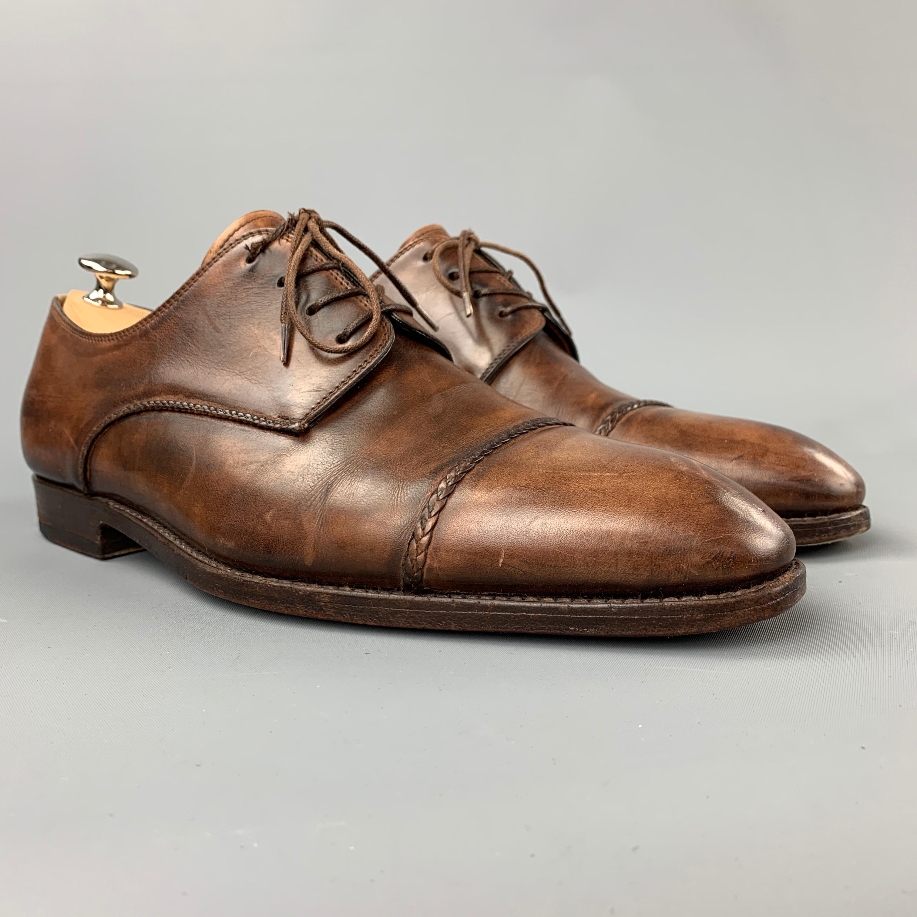 BONTONI dress shoes comes in a brown burnished leather featuring a cap toe, wooden sole, and a lace up closure. Made in Italy.

Very Good Pre-Owned Condition.
Marked: 9/10

Outsole: 12 in. x 4 in. 