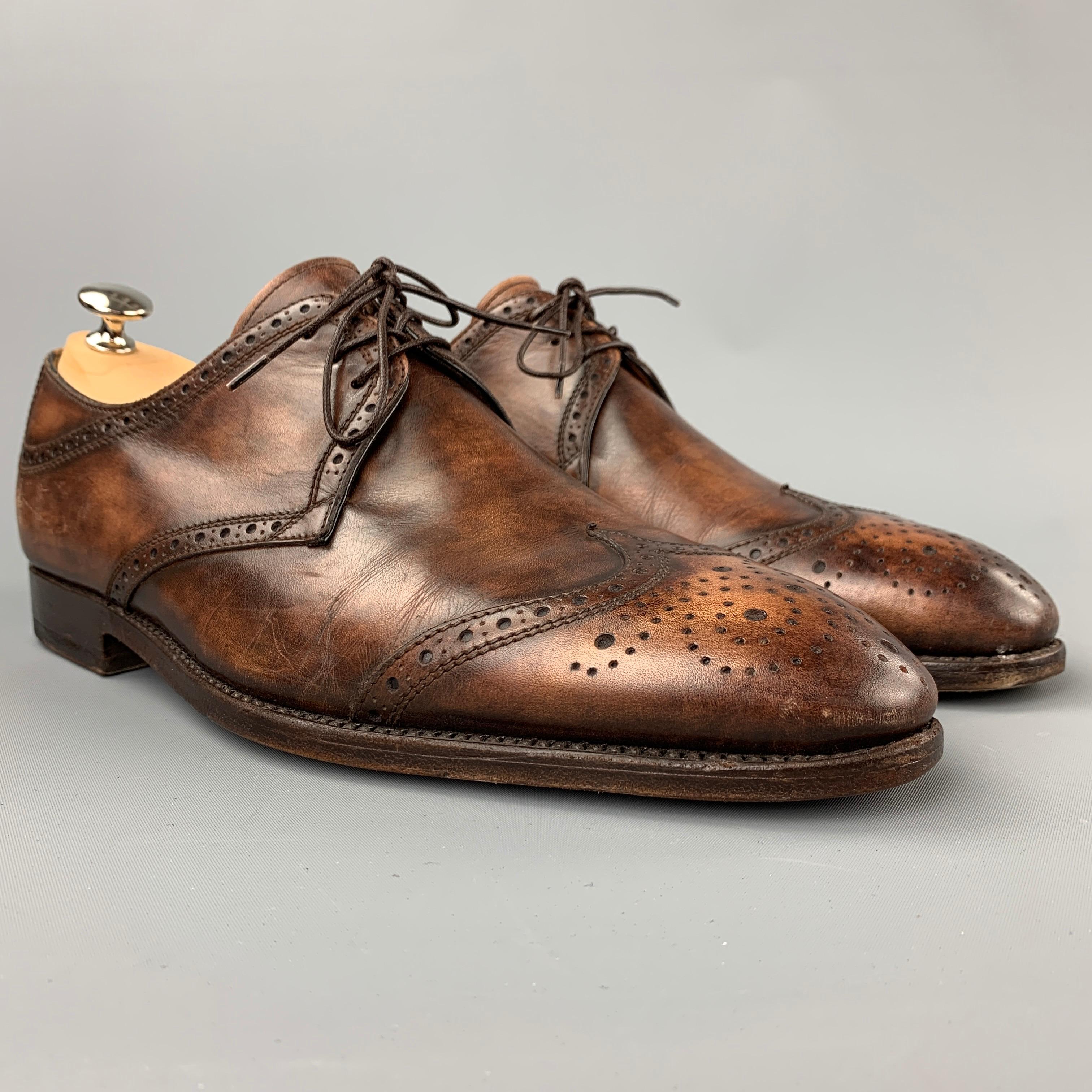 BONTONI dress shoes comes in a brown burnished perforated leather featuring a wingtip, wooden sole, and a lace up closure. Includes shoe horn. Made in Italy.

Very Good Pre-Owned Condition.
Marked: 9/10
Original Retail Price: $1,210.00

Outsole: 12