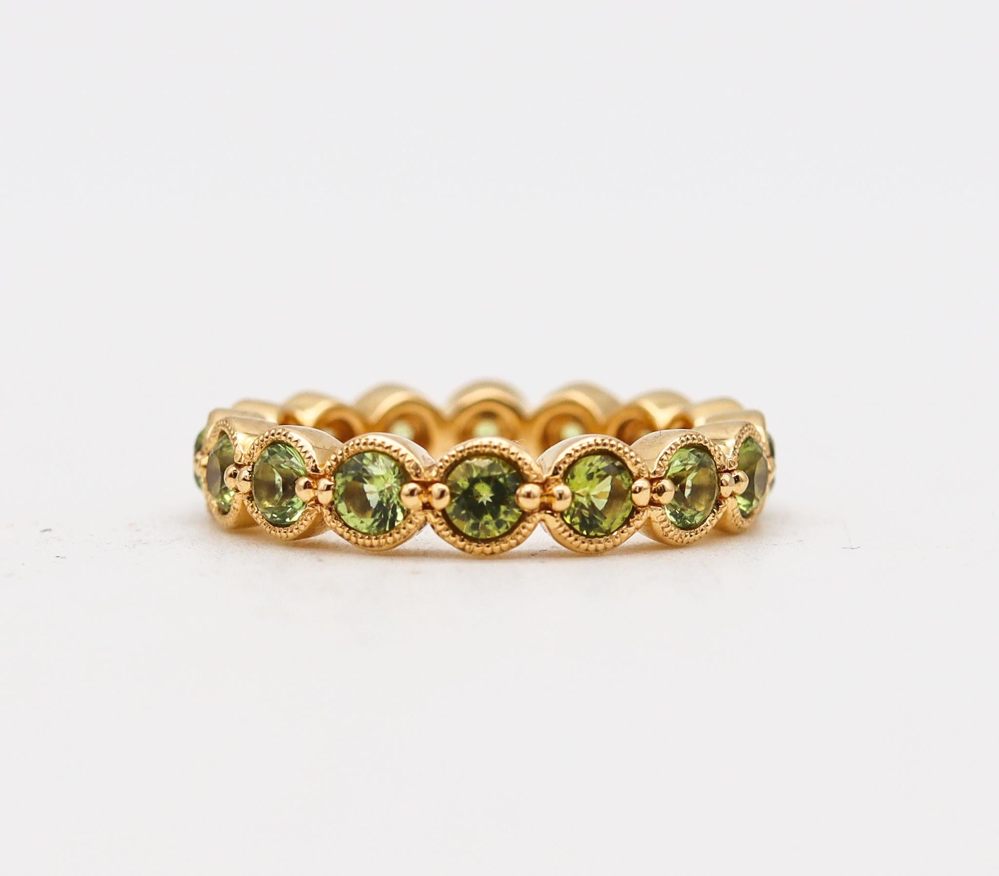 Modernist Bony Levy Eternity Band Ring in 18Kt Yellow Gold with 2.42 Cts in Green Peridots For Sale