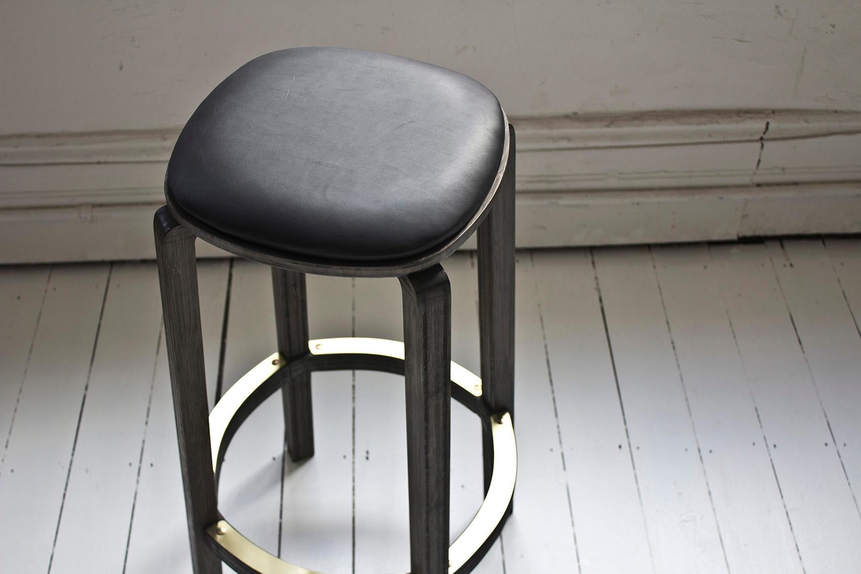 Boo stools are sturdy and versatile, made from 100% solid bamboo. Available in a Japan black stain finish with a polished brass foot guard and leather cushions. Boo stools can also be made in custom dimensions.
