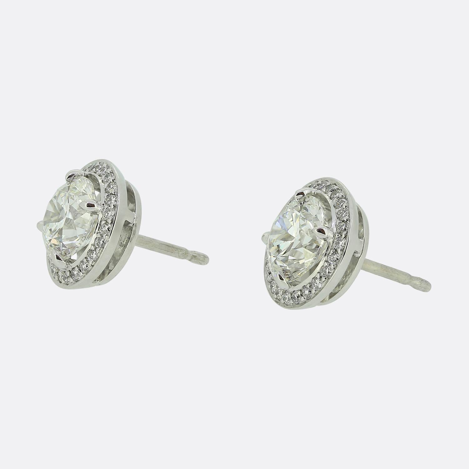 Here we have a meticulously designed pair of diamond stud earrings from the renowned British jewellery designer, Boodles. Each earring features a centralised bright white round brilliant-cut diamond, exuding an exceptional sparkle. These primary