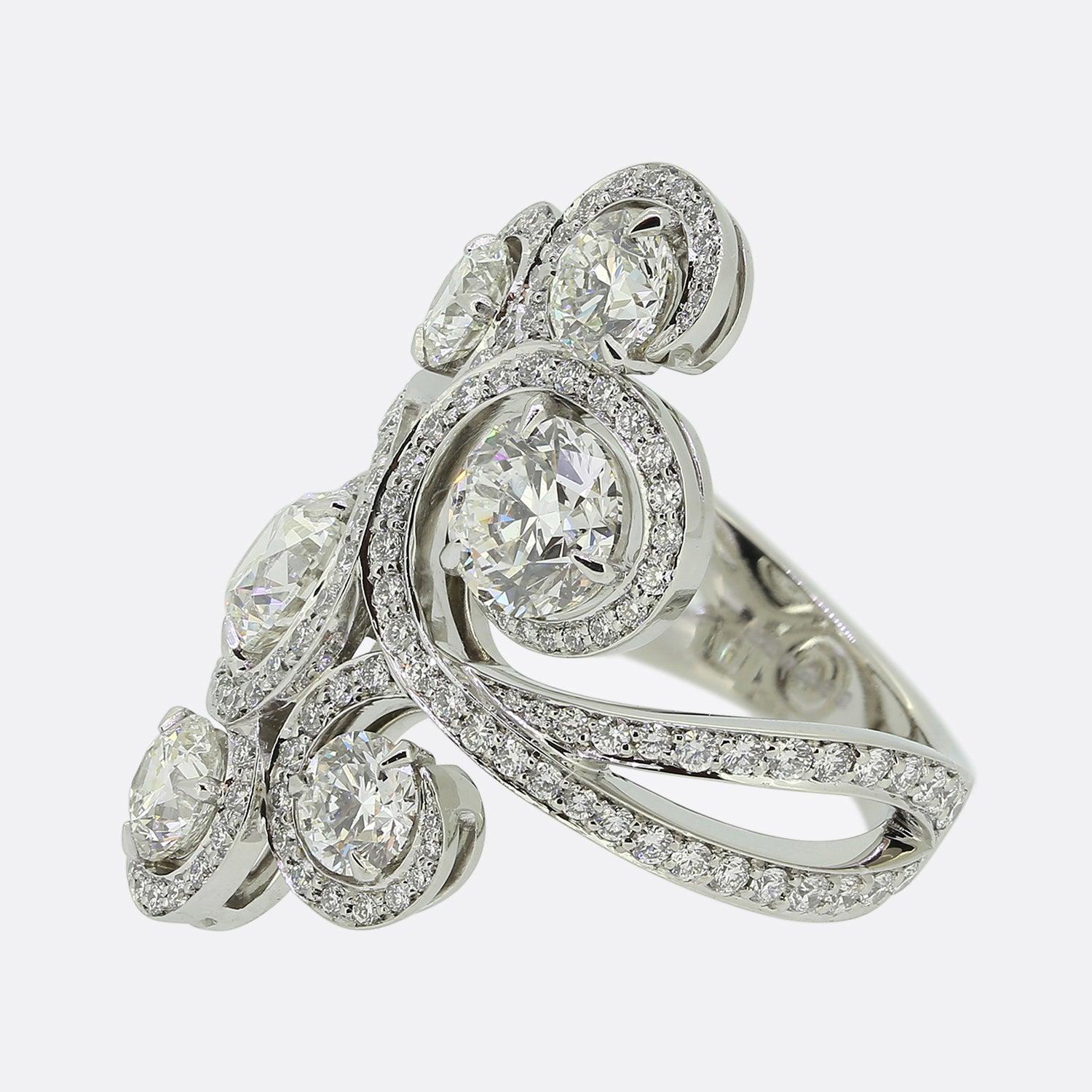 Here we have a beautifully crafted diamond ring from the world renowned luxury jewellery designer, Boodles. The ring features over 4 carats of round brilliant cut diamonds that are perfectly matched for colour and clarity. The two largest diamonds