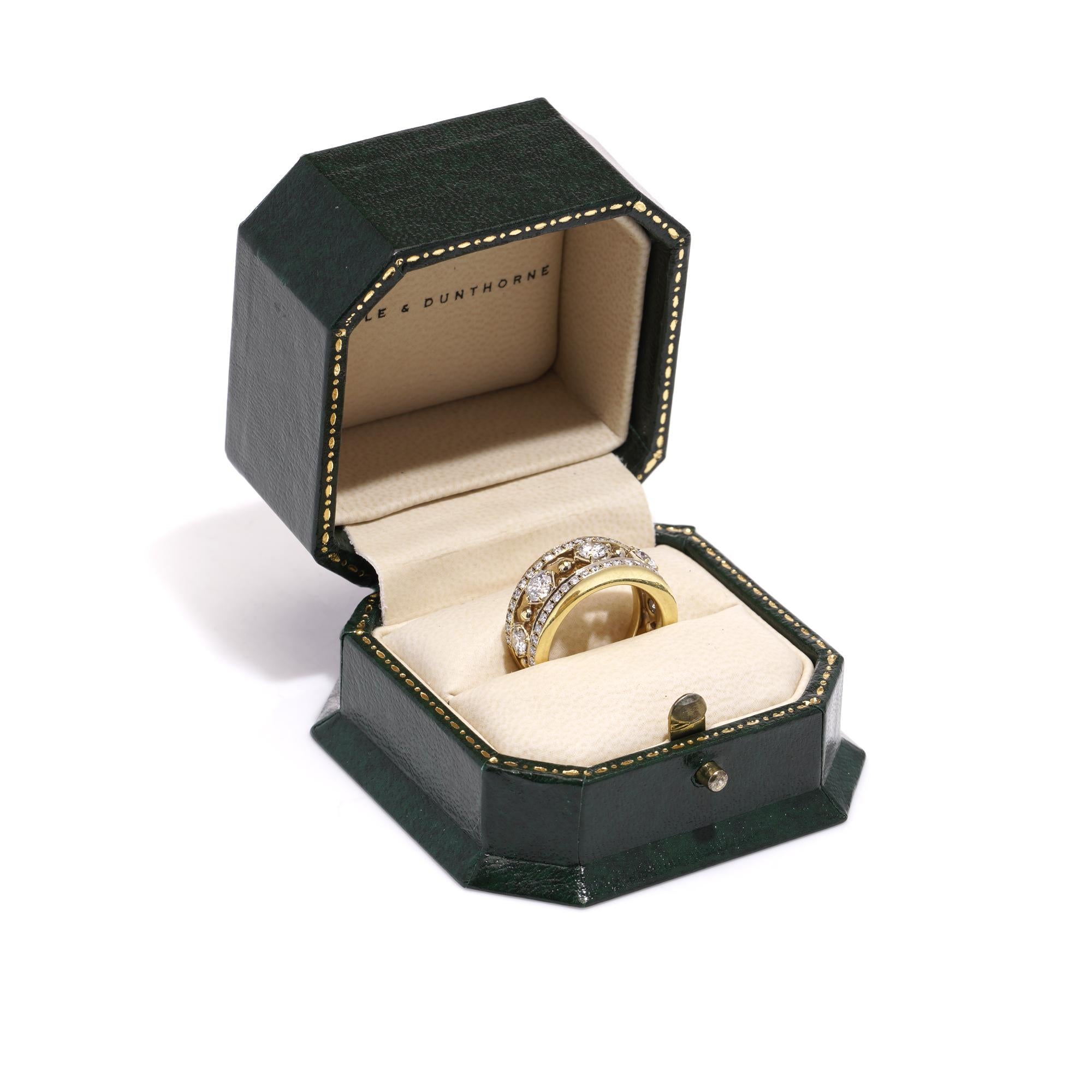 Boodles & Dunthorne 18kt. yellow gold band ring set with 1.46 carats of round brilliant-cut diamonds.
Designer: Boodles & Dunthorne
Fully hallmarked.
Made in England, Circa 2014

Diamonds -
Quantity of stones: 51
Carat weight:46 x 0.01 carats
2 x