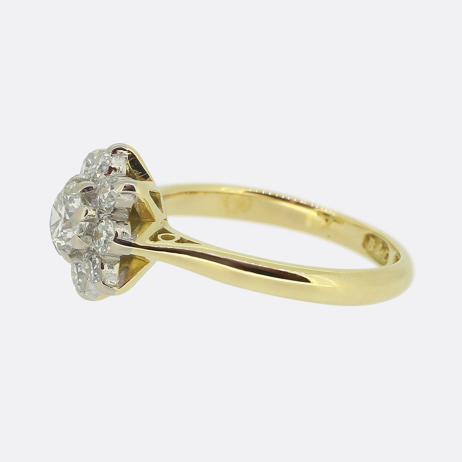 Here we have a classic diamond cluster ring from the luxury British jewellery designer, Boodles & Dunthorne. A single bright white 0.50 carat round brilliant cut diamond sits slightly risen at the centre of the face and is surrounded by slightly