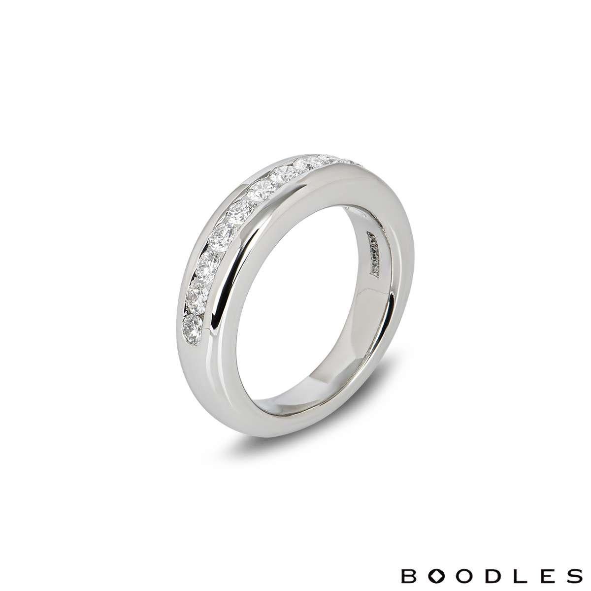 A platinum half eternity diamond ring by Boodles. The ring is channel set with 12 round brilliant cut diamonds with a total diamond weight of approximately 0.72ct. The band measures 5.8mm in width and tapers down to 4.3mm. The ring has a gross