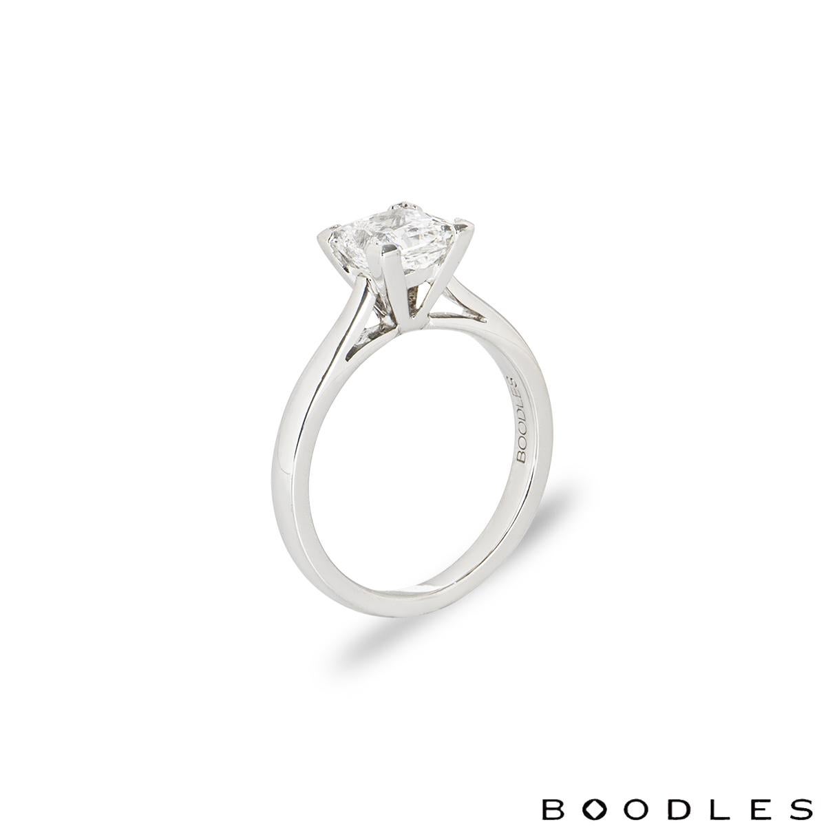 A stunning platinum diamond engagement ring by Boodles. The solitaire ring features a princess cut diamond set in a four claw mount weighing 1.20ct, F colour and VS1 clarity. The ring measures 2mm wide, has a gross weight of 4.07 grams and is