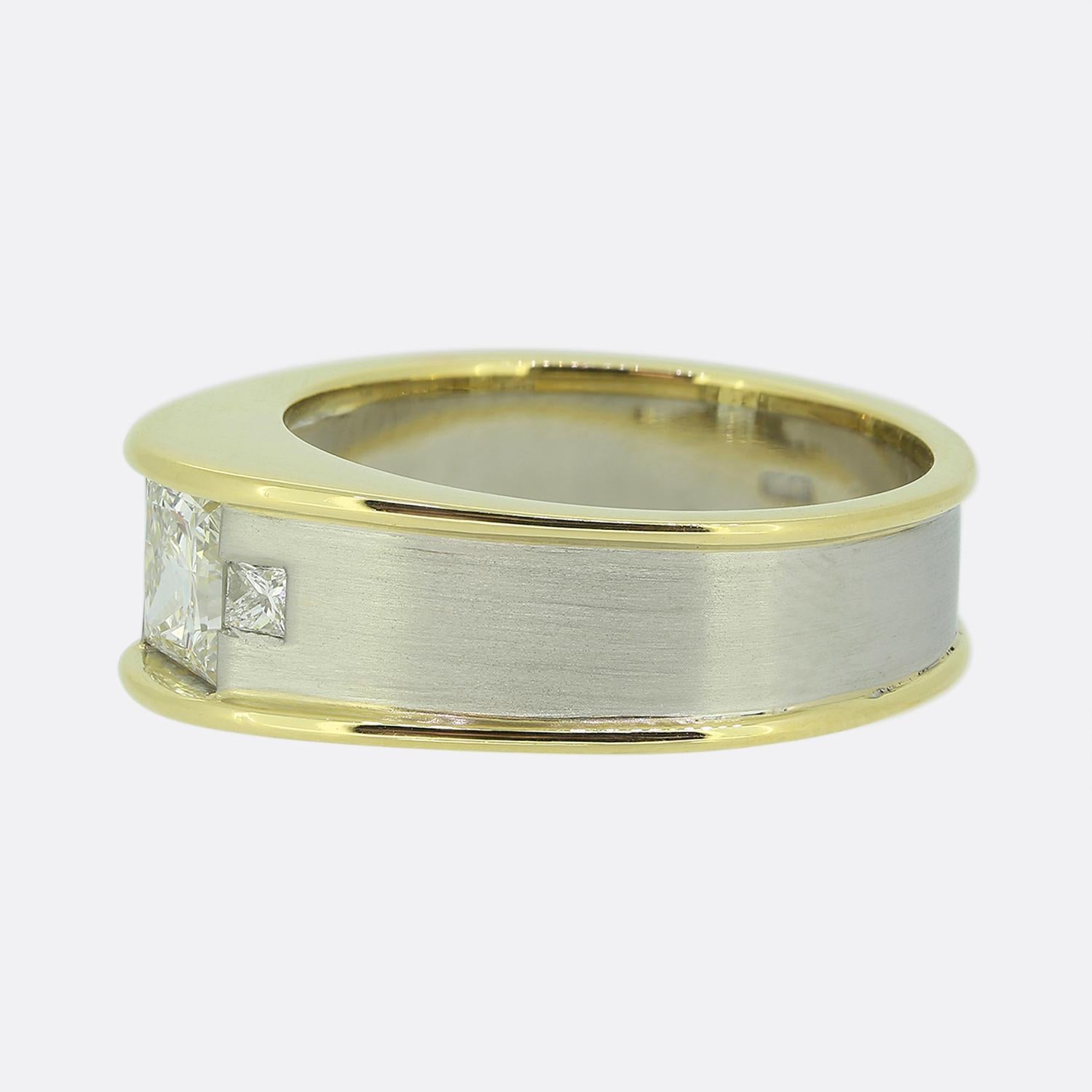 Here we have a fabulous diamond ring from the luxury British jewellery designer, Boodles. A sensational bright white princess cut diamond sits proud at the centre of the face whilst being flanked on either shoulder by a smaller matching stone. The