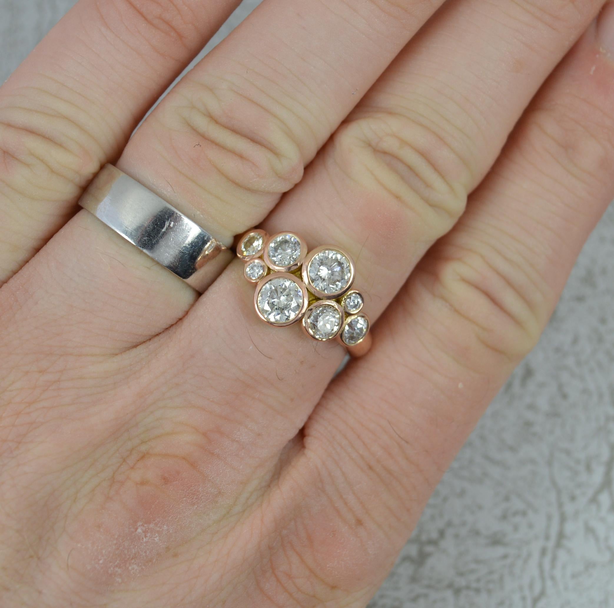 A beautiful 14 carat gold and diamond ring.
​​The 14 carat rose gold example.
Designed with eight round brilliant cut diamonds, each in a full grain/rubover setting of graduated sizes.
2.25 carat total.
18.5mm x 12.4mm cluster head.

CONDITION ;