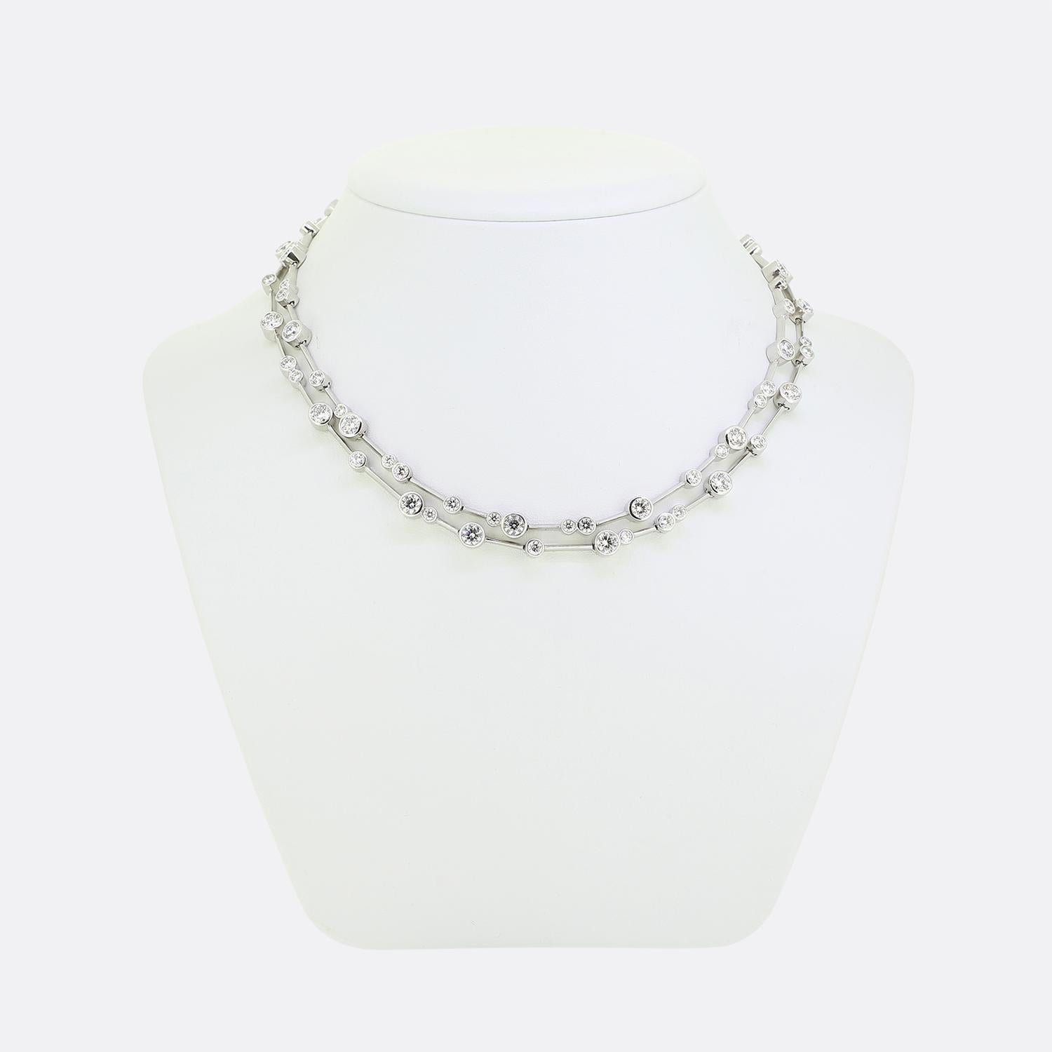 Here we have a remarkable creation from the world renowned luxury British jewellery designer, Boodles. This necklace features a scintillating array of bright white round brilliant-cut diamonds set in a modern, geometric design. The diamonds are