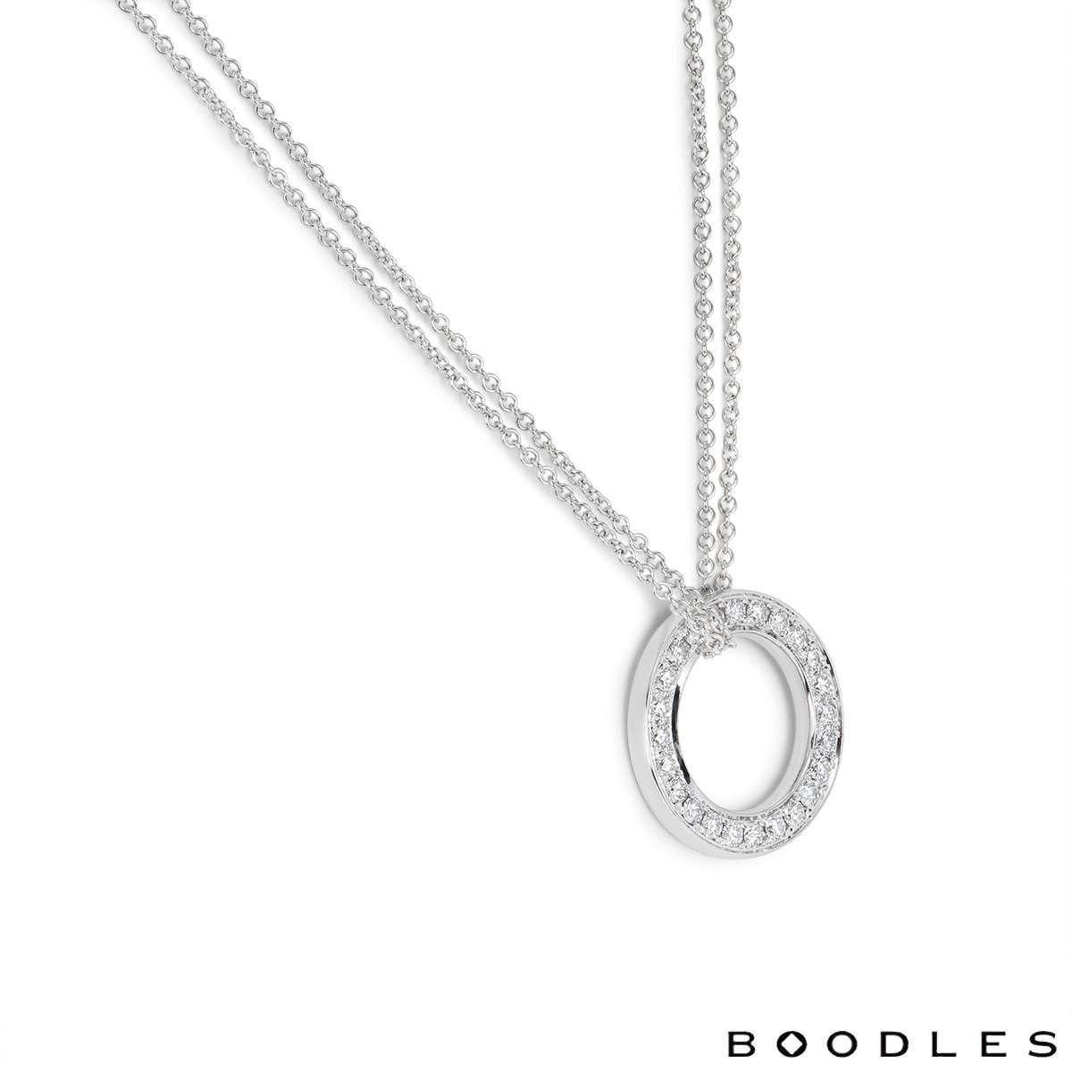 A classic diamond pendant in 18k white gold from the Roulette collection by Boodles. The circular openwork pendant is set with round brilliant cut diamonds to both sides, totalling approximately 2.50ct. The pendant measures 2.4mm in diameter and