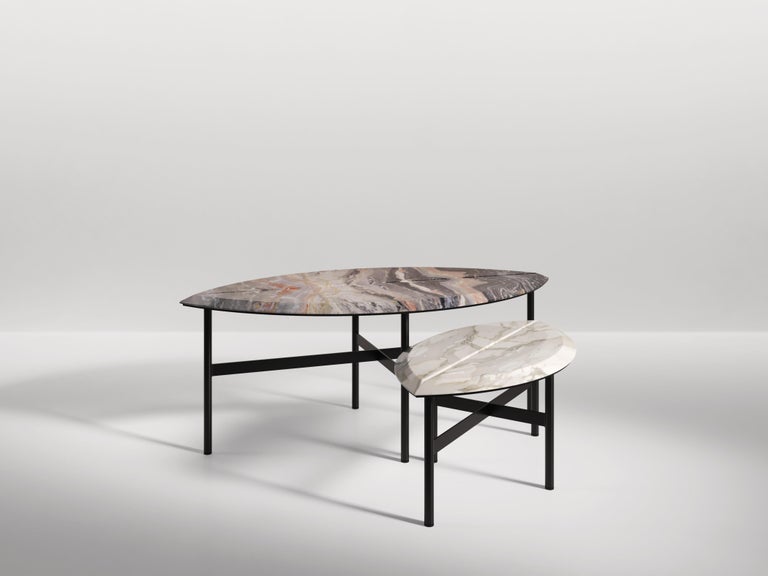 Two sizes of coffee table in the shape of two giant leaves. The veins of the book-matched marble mirror the veins of a leaf. Available in various marbles and natural stones as well as different metal finishes.

Dimension:
Book 1: 105cm x 55cm40cm