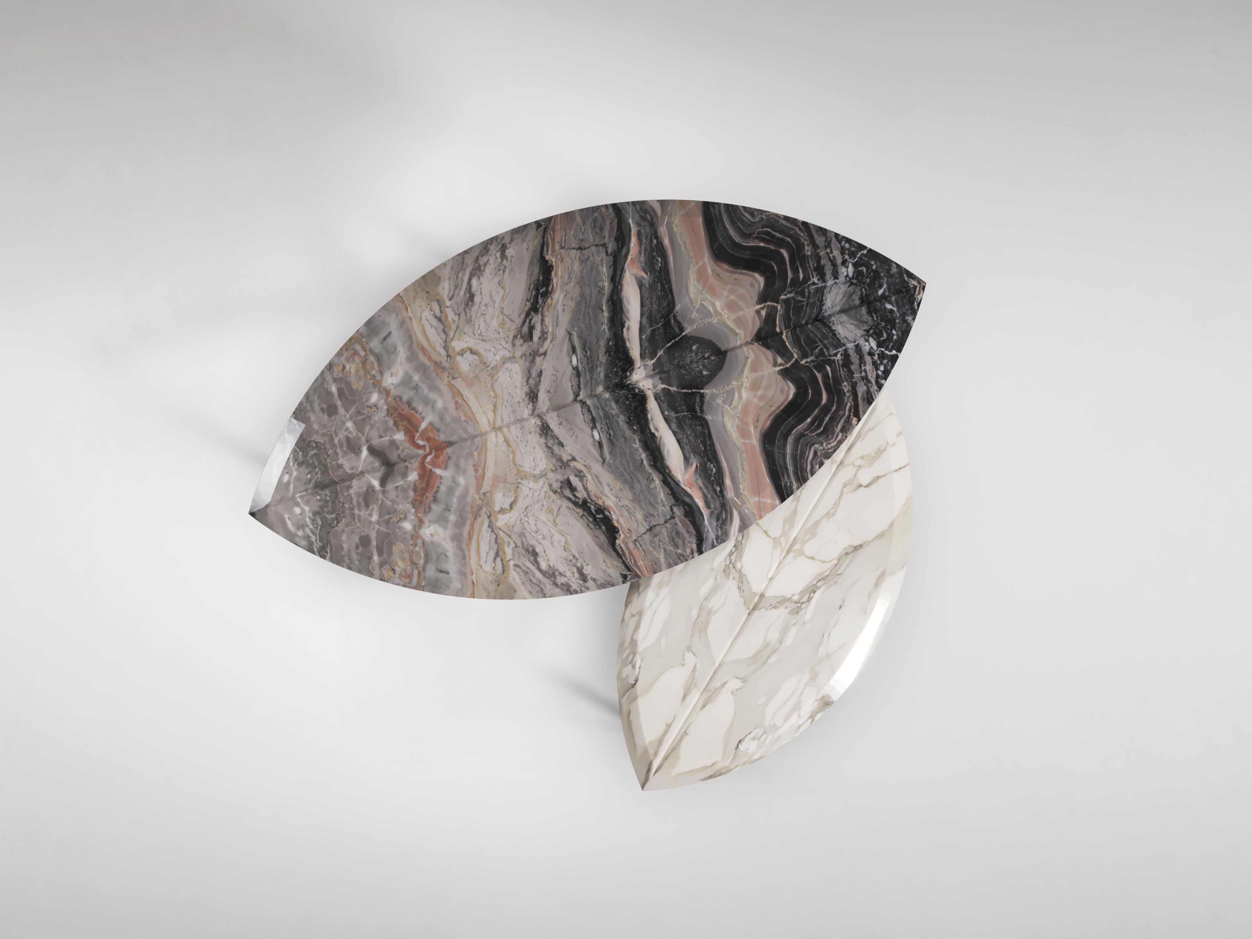 Two sizes of coffee table in the shape of two giant leaves. The veins of the book-matched marble mirror the veins of a leaf. Available in various marbles and natural stones as well as different metal finishes.

Dimension:
Book 1: 105cm x 55cm40cm