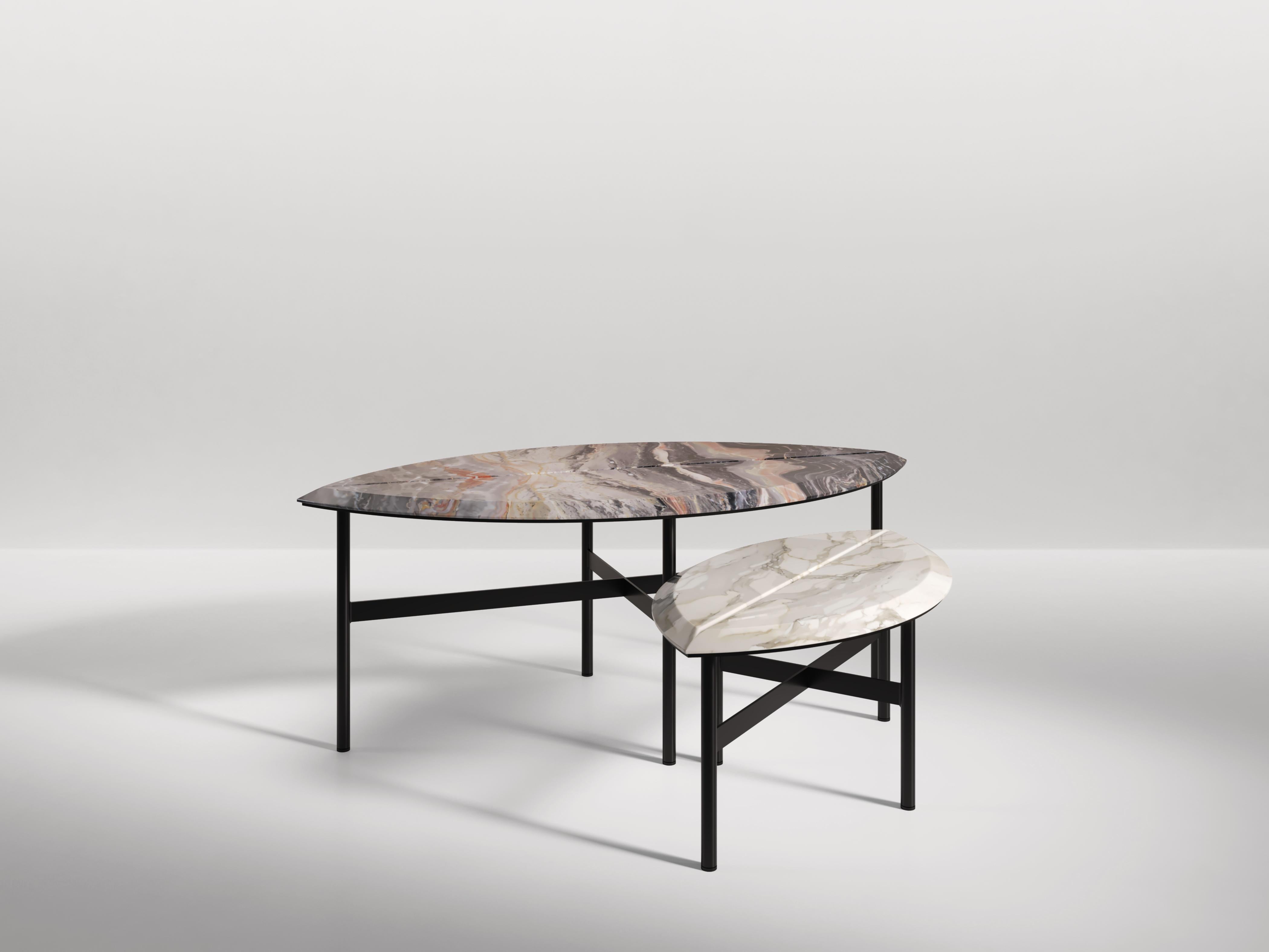 Two sizes of coffee table in the shape of two giant leaves. The veins of the book-matched marble mirror the veins of a leaf. Available in various marbles and natural stones as well as different metal finishes.

Dimension:
Book 1: 105cm x 55cm