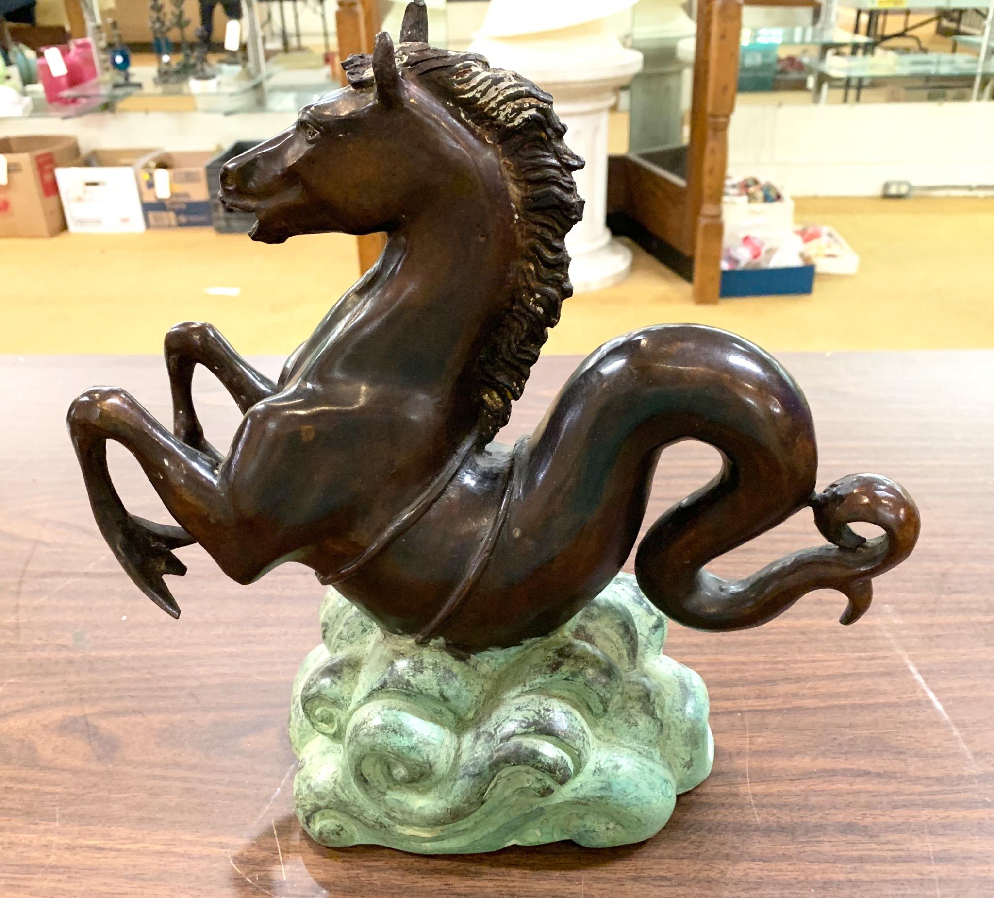 High quality brown patinated cast bronze stylized Sea Horse sculptures on verdigris sea foam bases. Would make striking bookends, table top decoration, or easily converted to lamp bases. Unsigned, but likely Italian, circa 1920s.