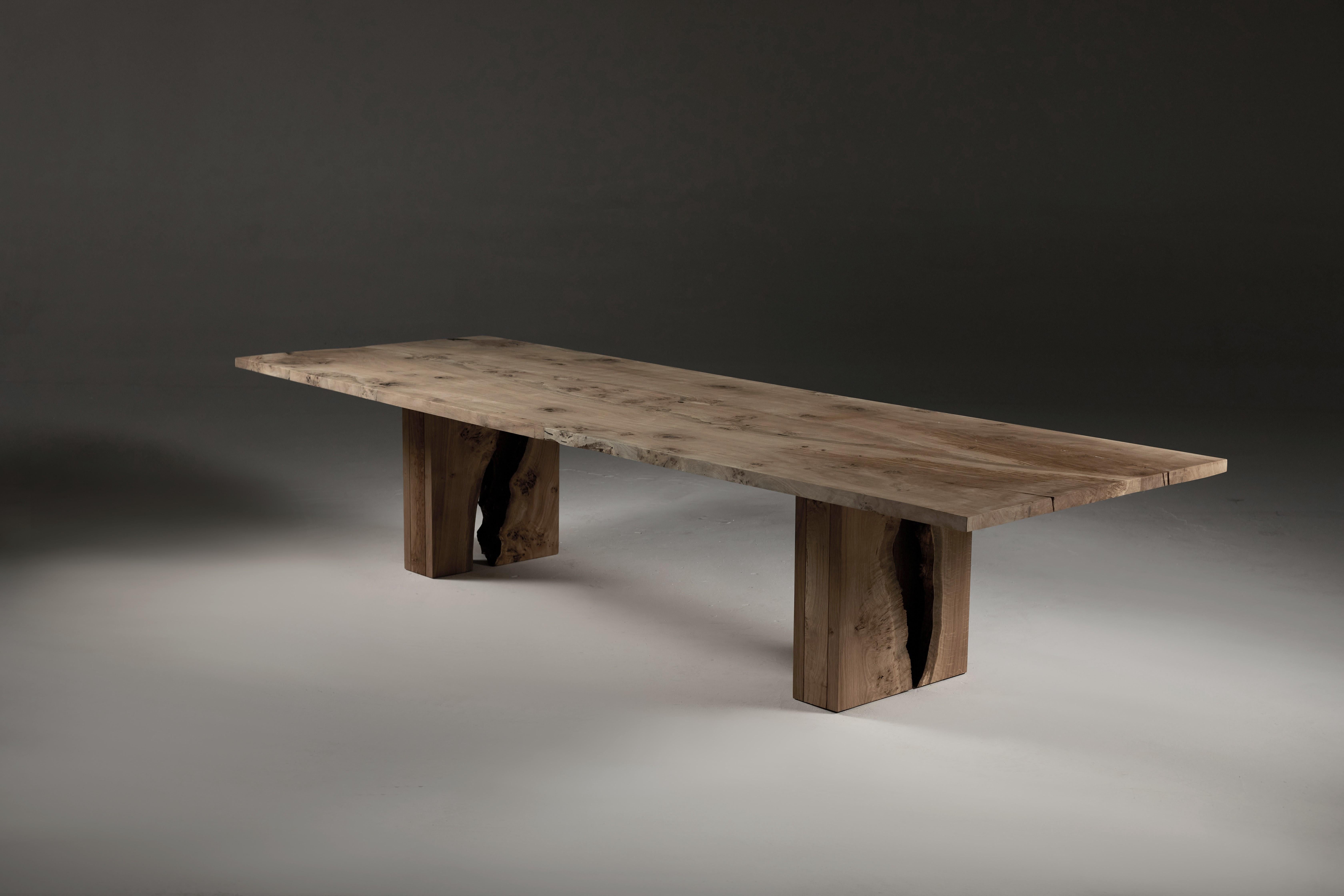Book-matched Oak tabletop with Inverted Live Edge legs by Jonathan Field.
The tabletop is made from two slabs of pippy European Oak that have been centrally joined along the live edge (no straight-line joins). The tabletop's natural pattern is
