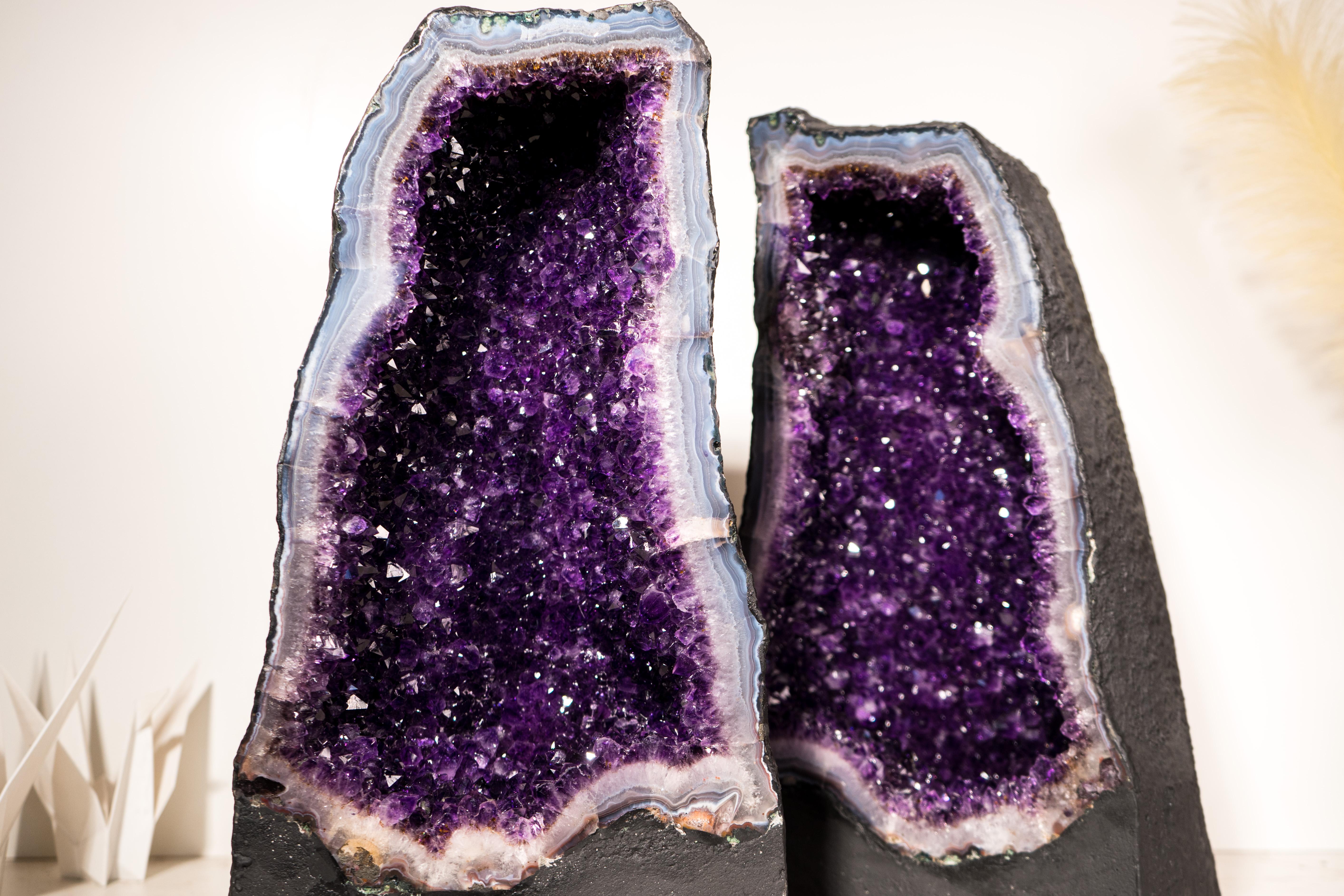 A Brazilian Bookmatched Pair of Geode Cathedrals with Beautiful Violet Purple Amethyst Druzy and a Sky-Blue Lace Agate Frame

Description

The ideal amethyst color is one that is neither too dark to be seen nor too light to lose its vibrant beauty.