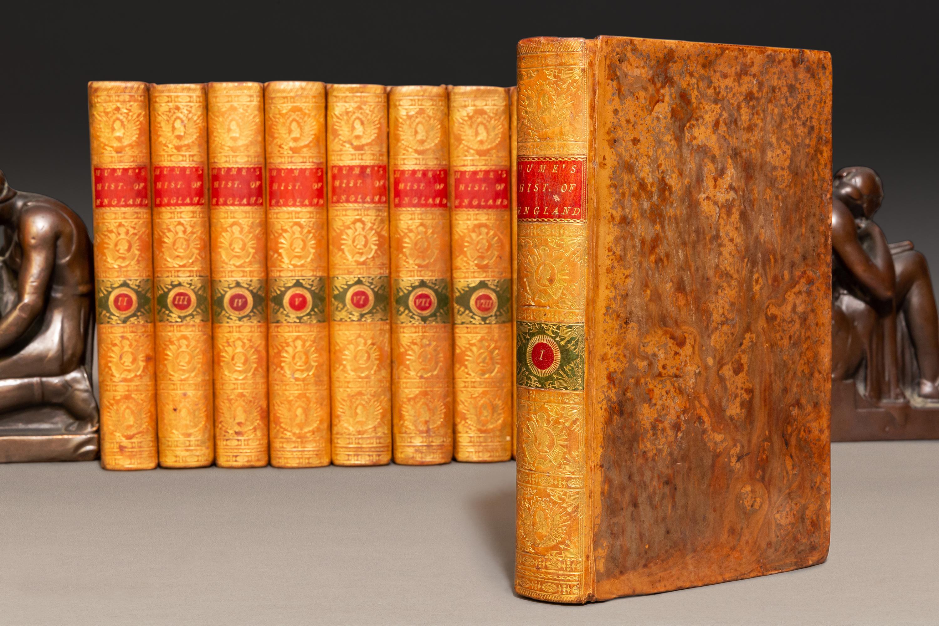 13 Volumes. David Hume & T.S.Smollett. History Of England.Bound in Full contemporary tan calf, illustrated, red and green labels, ornate gilt on spines. Published: London: T. Cadell 1789. Handsome set.