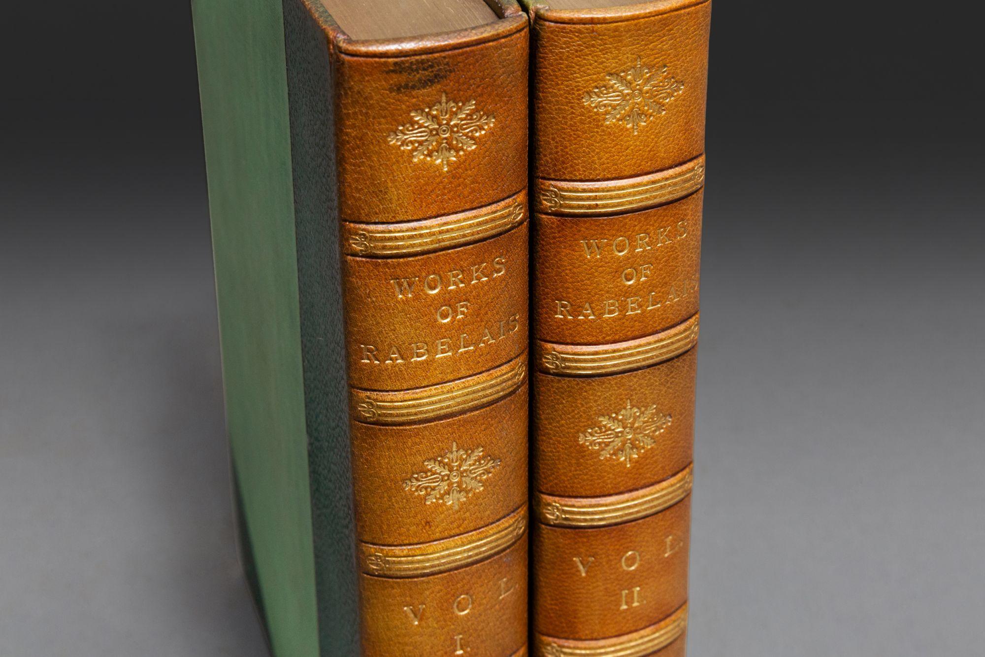 2 Volumes. Francois Rabelais. The Complete Works. Illustrated by W. Heath Robinson. Frontispiece of Gargantua. Bound in 3/4 green morocco by Kelly. Linen boards, marbled endpapers, gilt on spines, raised bands, top edges gilt. 
Published: