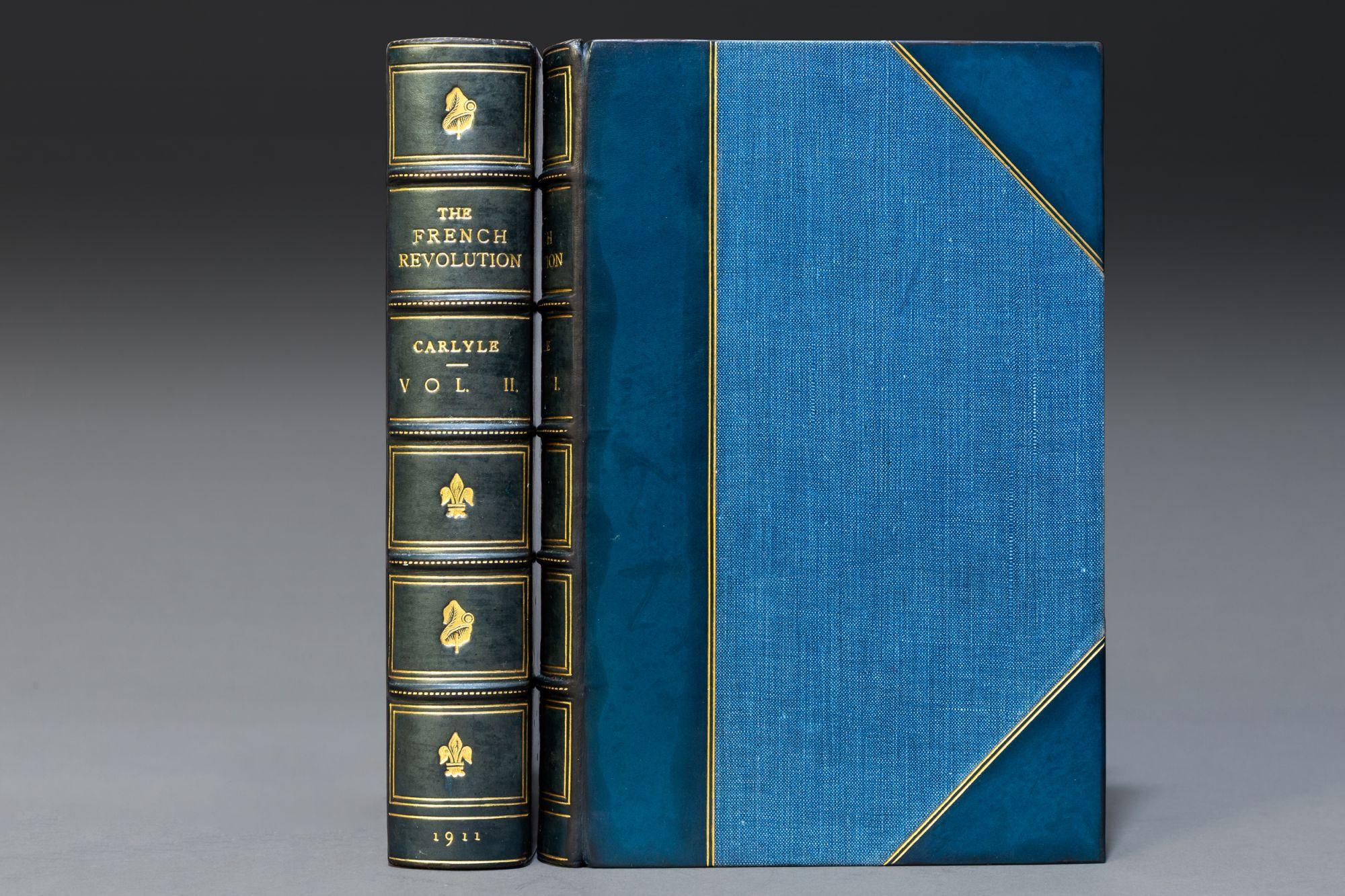 2 Volumes. Thomas Carlyle. The French Revolution. Bound in 3/4 blue calf by Morrell. Printed by Robert Maclehouse & Co. in Glasgow. Linen boards, marbled endpapers, gilt on covers & spines, raised bands, top edges gilt. 
Published: London: