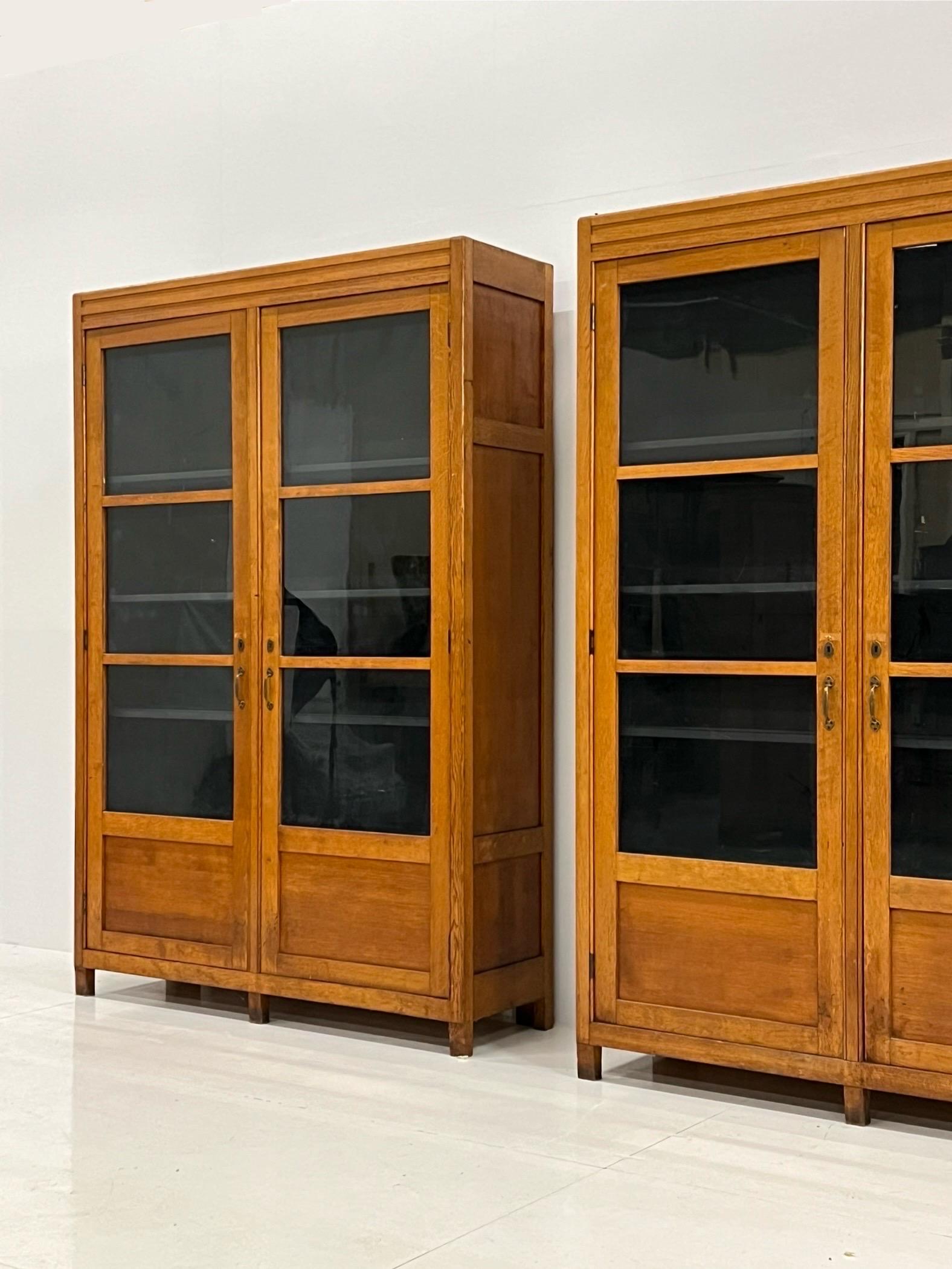 Also for sale separately. This set of 2 fantastic Art Deco display cabinets / bookcases / sideboards. Made of solid oak. Art Deco style, early 20th century. With anthracite colored interior.

Cabinets are both in very good condition. Here and there