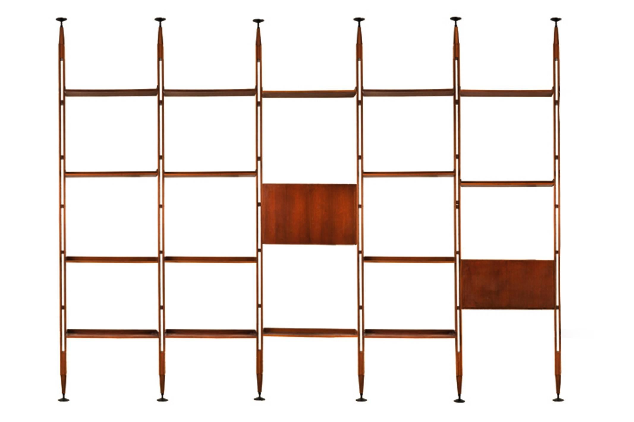 Bookcase structure composed of rosewood with black-painted aluminum brackets on top and bottom, supporting two cabinets and adjustable shelves. Literature: Giuliana Gramigna’s Repertorio del Design Italiano 1950-2000, Vol. I, Milano, 1985, model
