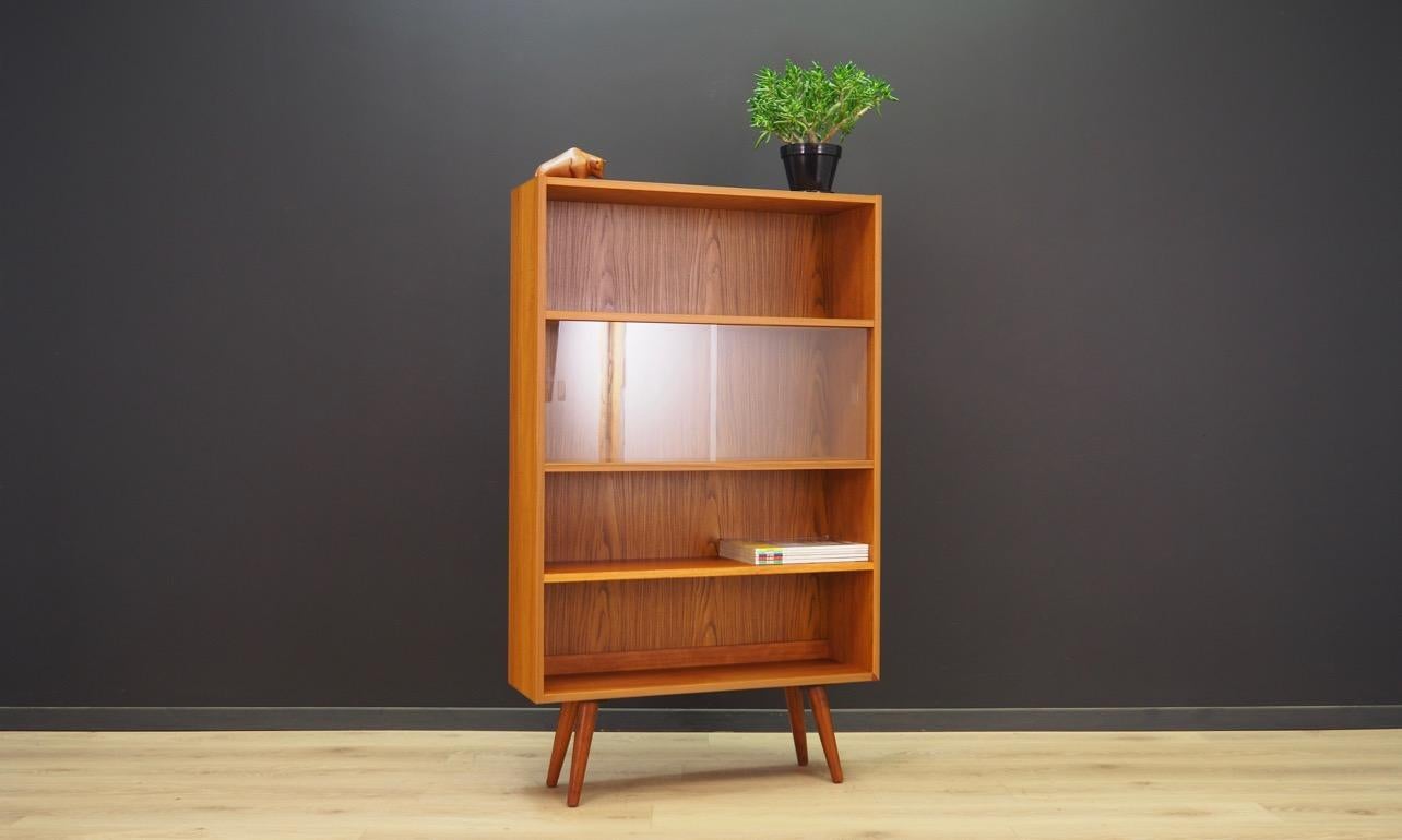 Bookcase - library from the 1960s-1970s, Minimalist form - Danish design. Bookcase finished with teak veneer. The furniture has a sliding glass door,. Preserved in good condition (small bruises and scratches, filled veneer loss) - directly for