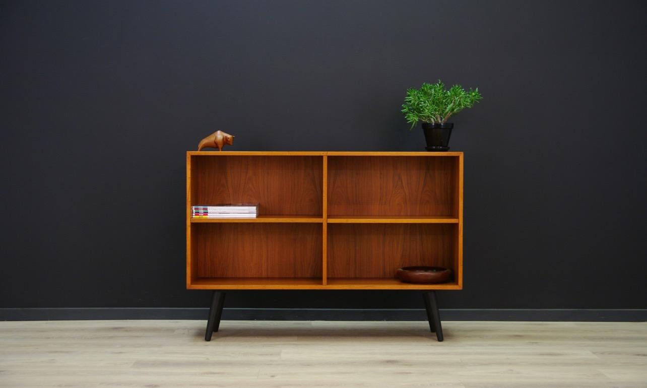 Classic bookcase, library from the 1960s-1970s, Minimalistic form, Scandinavian design. The whole veneered with teak. Possibility to adjust the shelves. Preserved in good condition (small bruises and scratches), directly for use.

Dimensions: