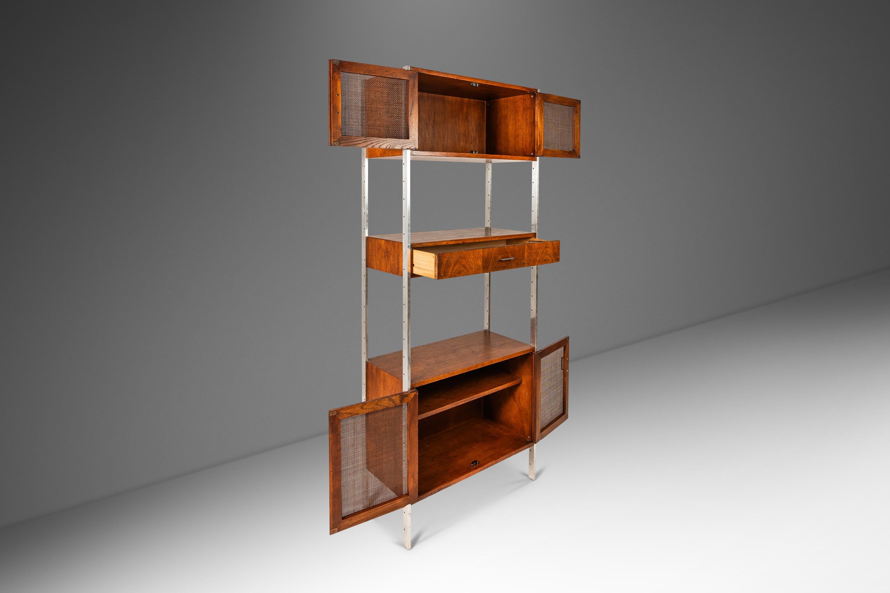  Introducing an ultra functional single-bay wall unit designed by the influential Jack Cartwright for Founders. Featuring two cabinets and a mixed-use writing surface/large storage drawer this versatile wall unit can be arranged in a limitless