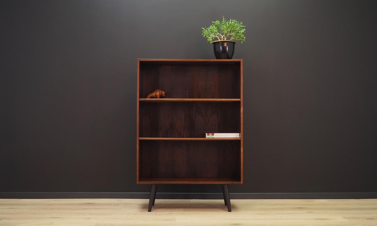 Classic bookcase or library from the 1960s-1970s. Scandinavian design, Minimalist form. Surface of the furniture finished with rosewood veneer. Shelves with adjustable height. Maintained in good condition (minor bruises and scratches) - directly for
