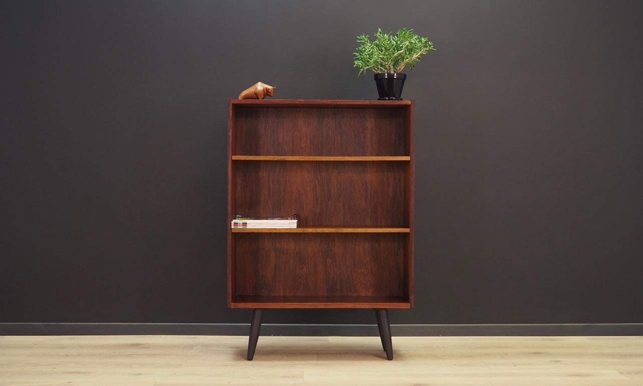 Vintage bookcase from the 1960s-1970s, minimalistic, Scandinavian design. Furniture finished with rosewood veneer, with adjustable shelves. Preserved in good condition (minor bruises and scratches) - directly for use.

Dimensions: Height 113.5 cm,