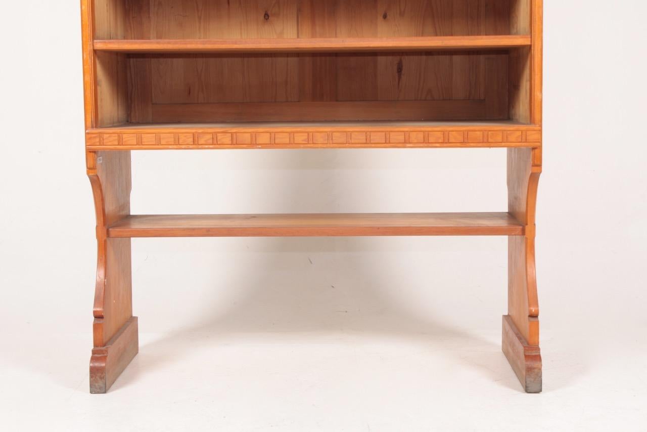 Bookcase in patinated solid pine. Designed by MAA. Martin Nyrop as interior for Copenhagen town hall in 1905. Made in Denmark by Cabinetmaker Rud Rasmussen cabinetmakers. Great original condition.

   