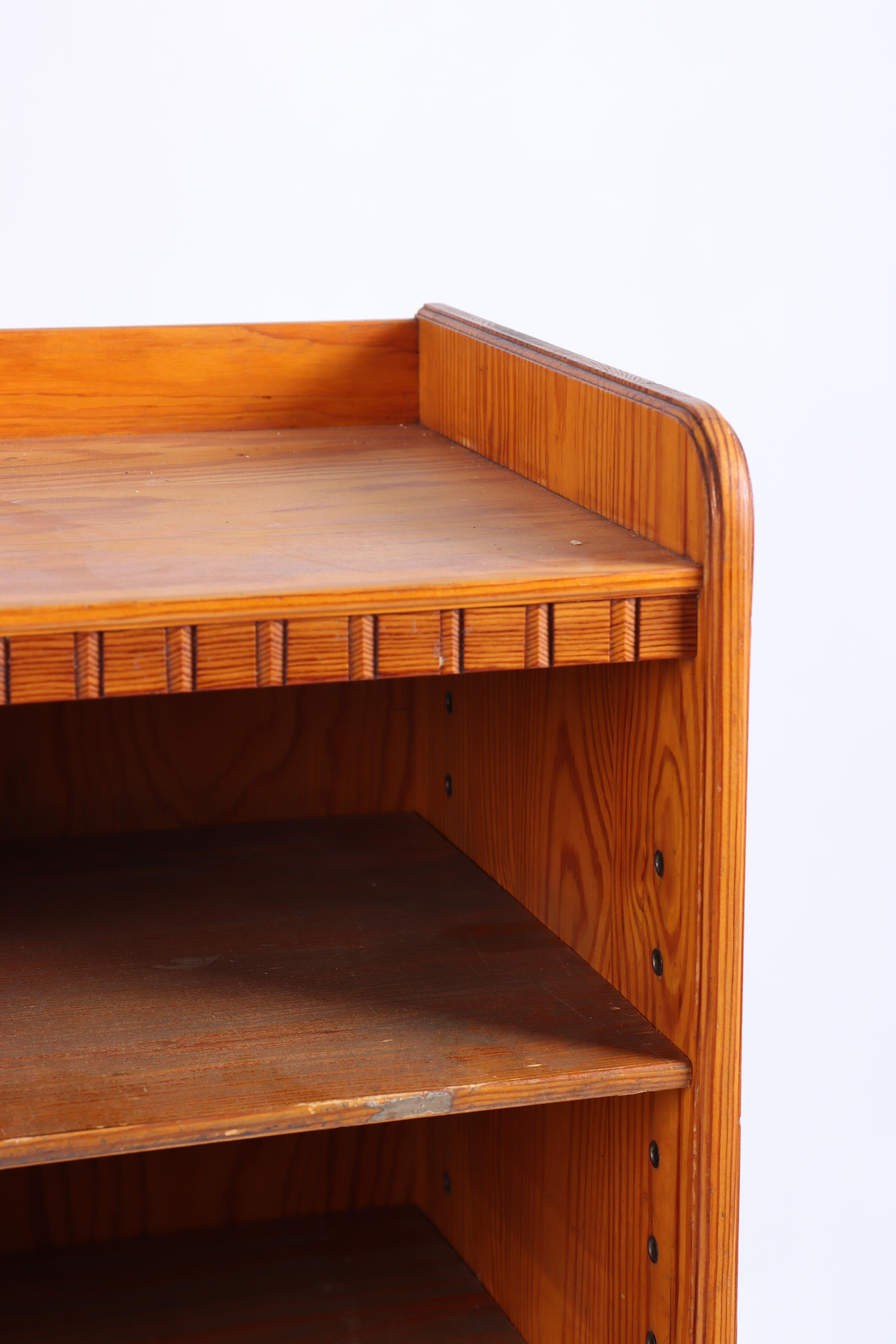 Bookcase in patinated solid pine. Designed by MAA. Martin Nyrop as interior for Copenhagen town hall in 1905. Made in Denmark by Cabinetmaker Rud Rasmussen cabinetmakers. Great original condition.

