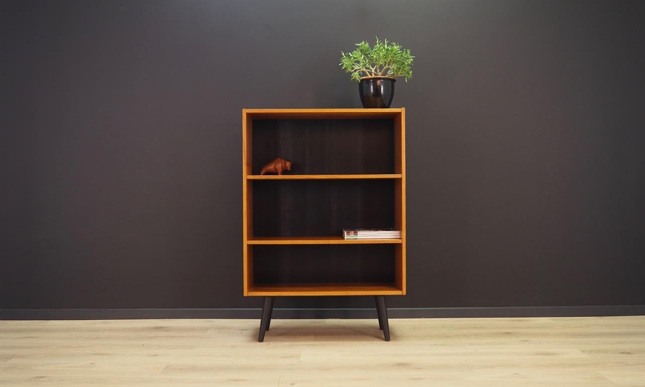 A Classic bookcase, library from the 1960s-1970s. Scandinavian design, Minimalist form. Furniture finished with teak veneer. Shelves with adjustable height. Maintained in good condition (minor bruises and scratches, filled veneer cavities), directly