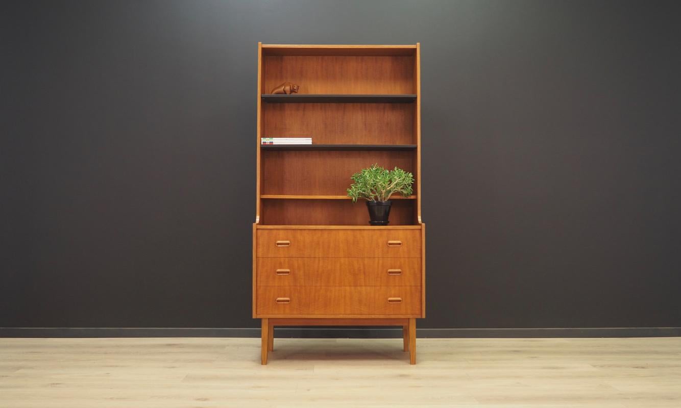 Classic bookcase - library from the 1960s-1970s, Scandinavian design. The surface of the furniture finished with teak veneer. Shelves with adjustable height. Maintained in good condition (minor bruises and scratches) - directly to