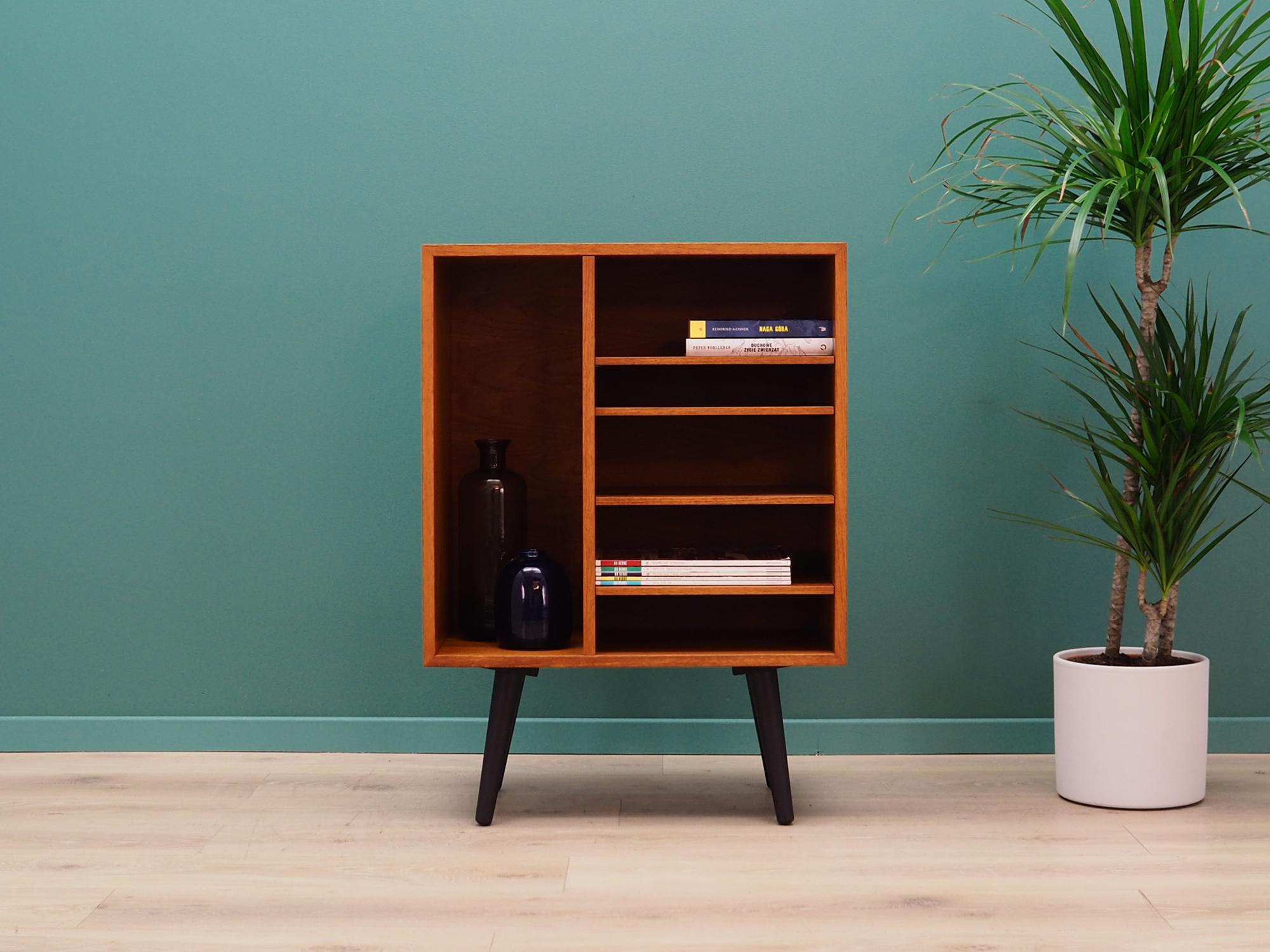 Unusual bookcase, library from the 1960s-1970s. Danish design, Minimalist form. The surface of the furniture finished with teak veneer. Shelves with height adjustment. Preserved in good condition (small bruises and scratches), directly for