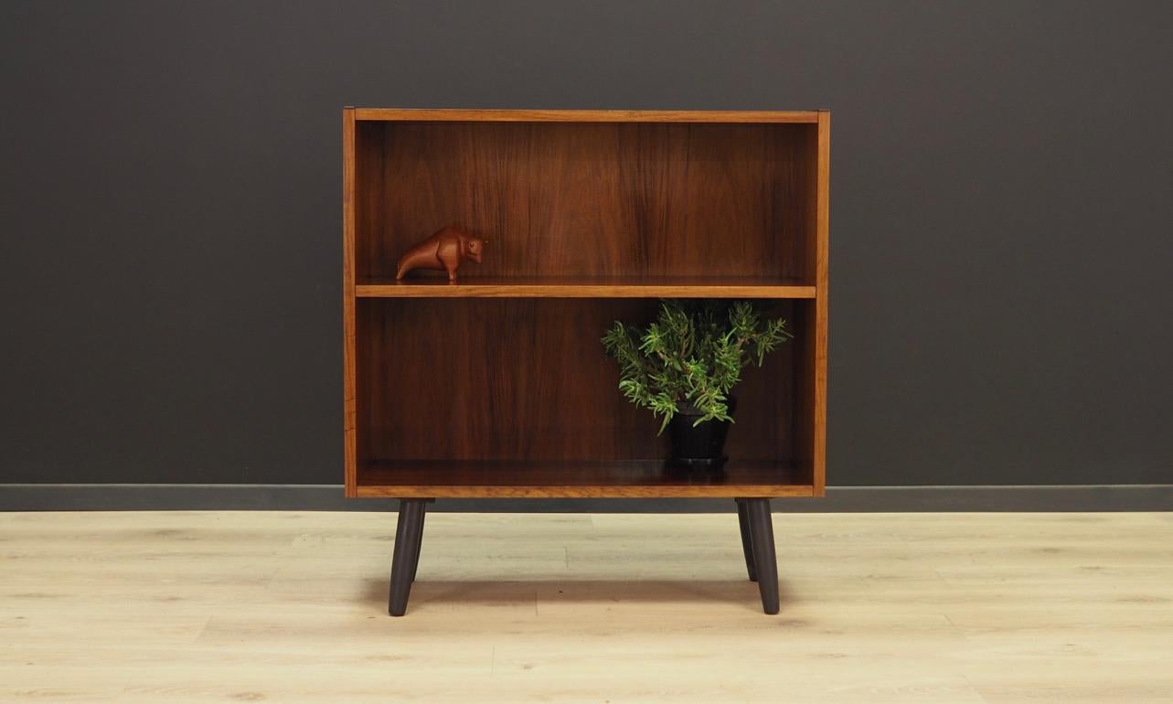 Classic bookcase or library from the 1960s-1970s, minimalist form, Danish design. Surface covered with rosewood veneer. The furniture has a shelf with adjustable height. Maintained in good condition (minor bruises and scratches), directly for