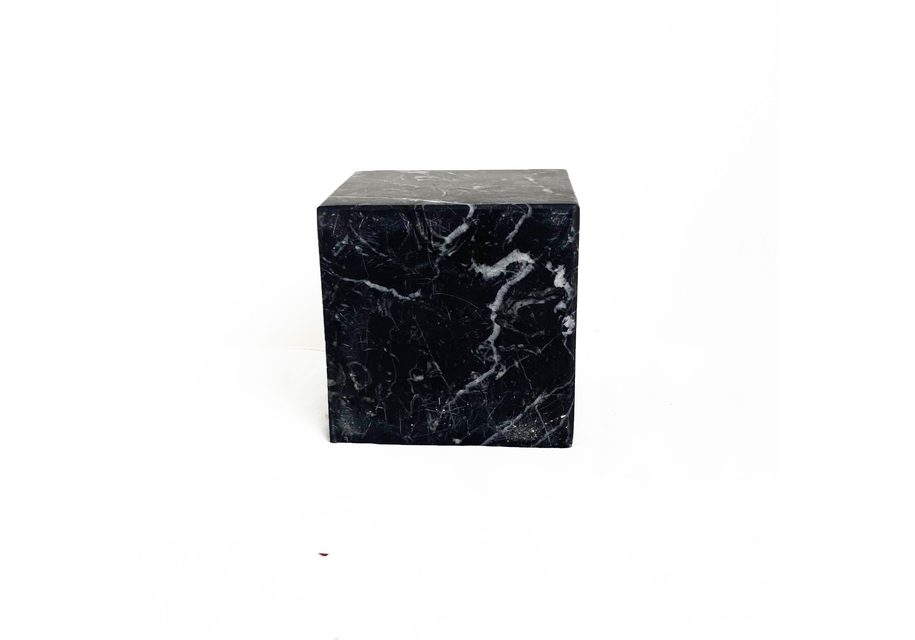 A blocks of precious black Marquina marble precision machine carved and hand polished. The cube can be use as book-end, door-stop or simply a sculpture on your desk or shelf. A sort of philosophical stone, absorbing your thoughts and making you