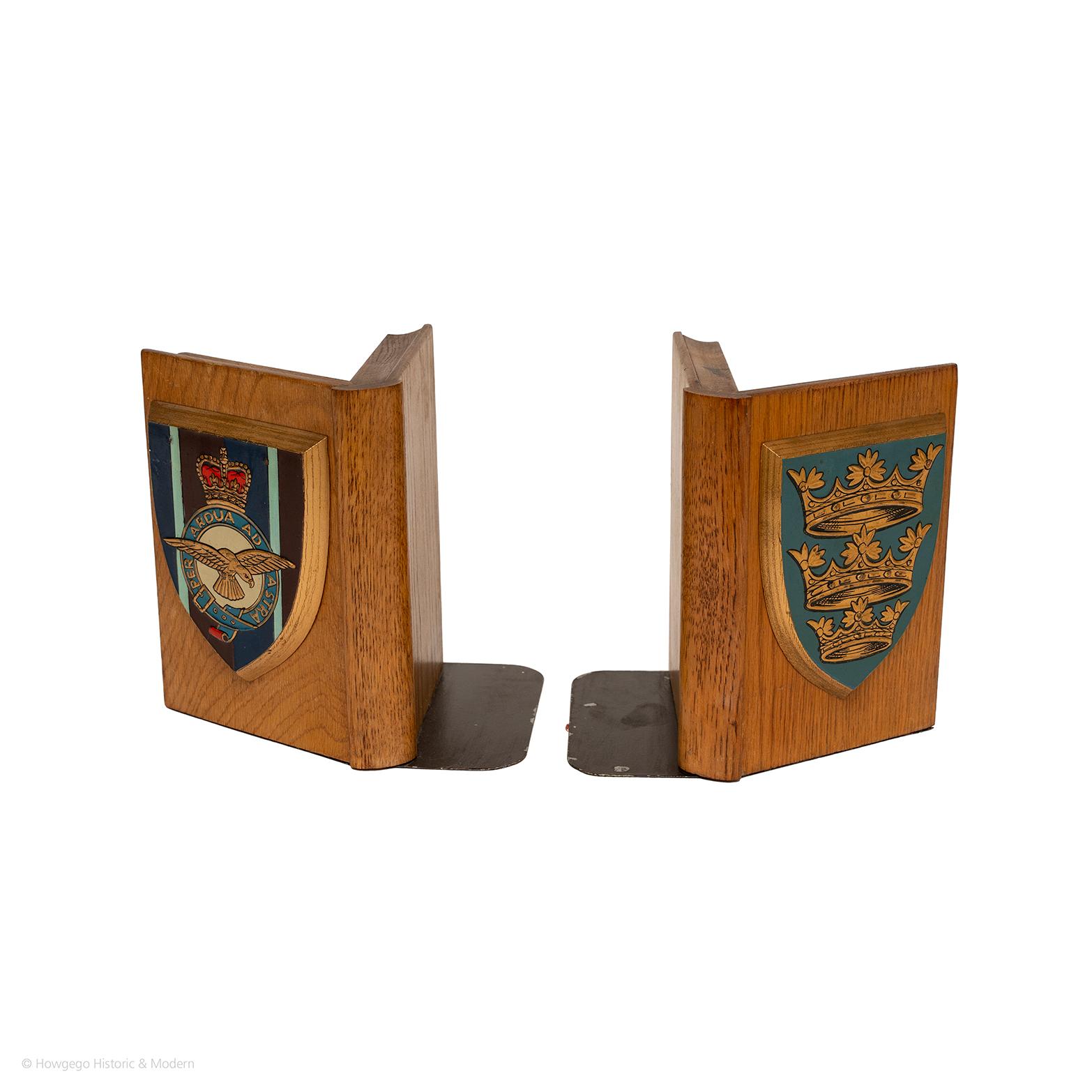 One oak bookend with a polychrome Badge of the Royal Air Force and bearing the motto : Per Ardua ad Astra