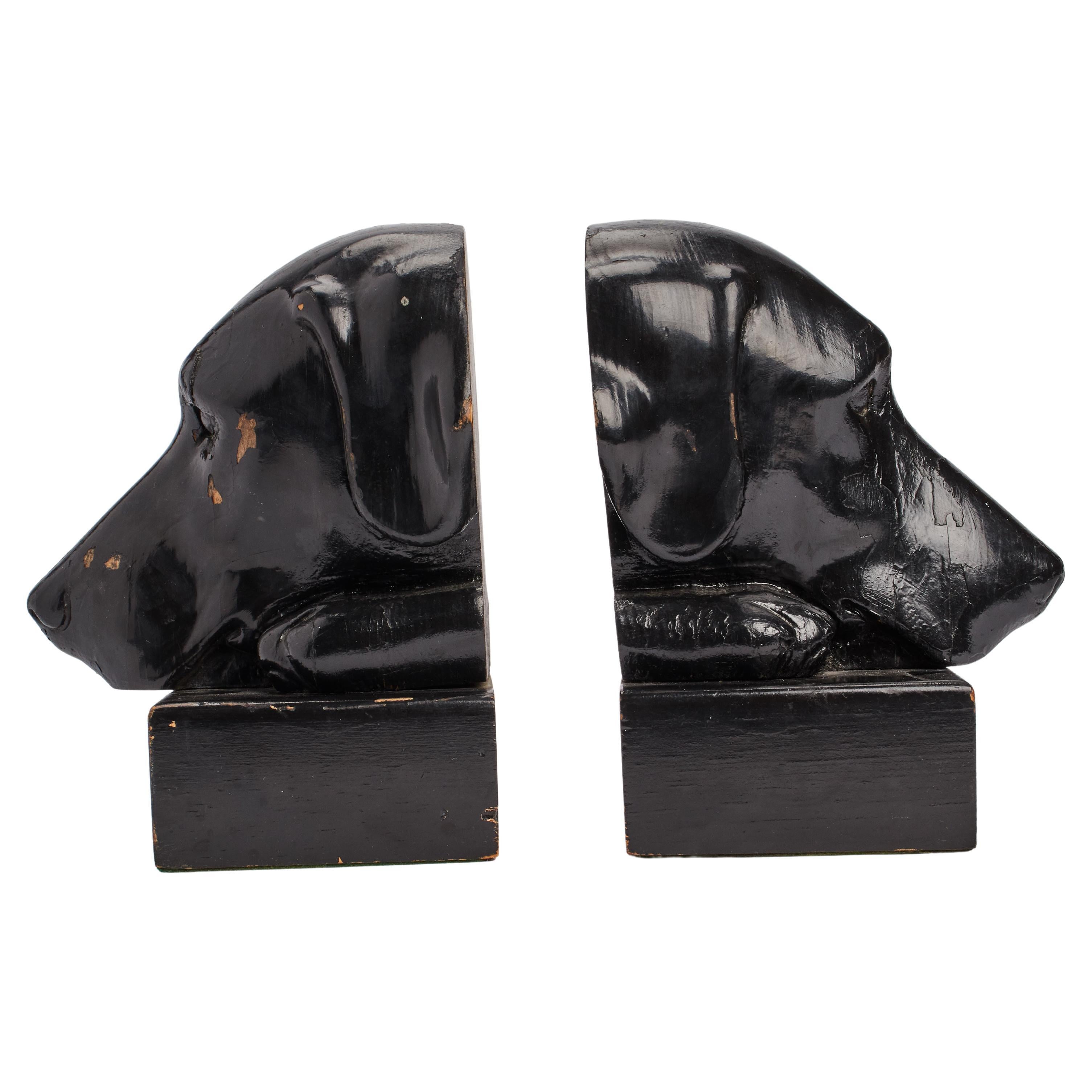 Bookends depicting the heads of black labrador dogs, England 1890.
