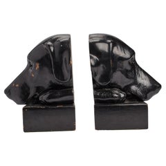 Bookends depicting the heads of black labrador dogs, England 1890.