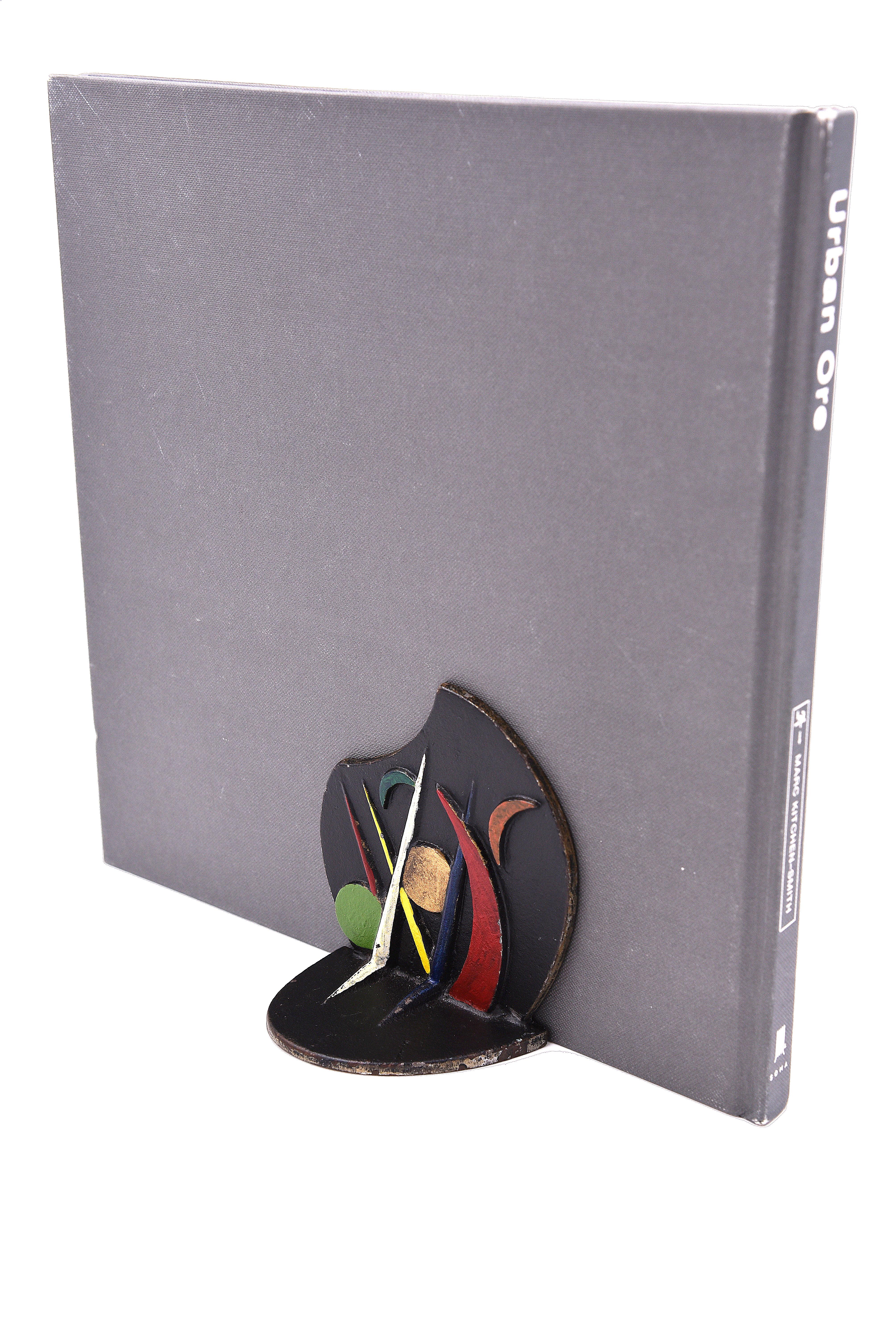 This set of bookends serves more for decoration than its intended purpose because they are quite small and light in weight. We like the set because of its simplicity and because they may have debut at a World's Fair. They show some wear. Unsigned.