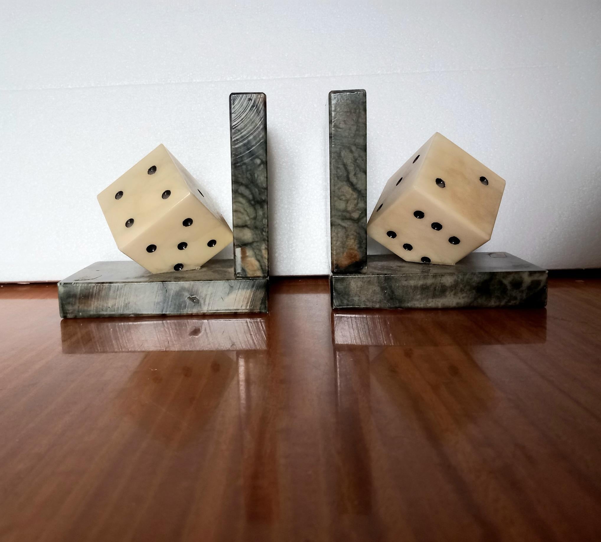 alabaster or marble dice-shaped bookends

  I am not a player but for some reason when I see a dice or a card from the deck I associate it with something positive, good luck
That's why I like these pretty dice