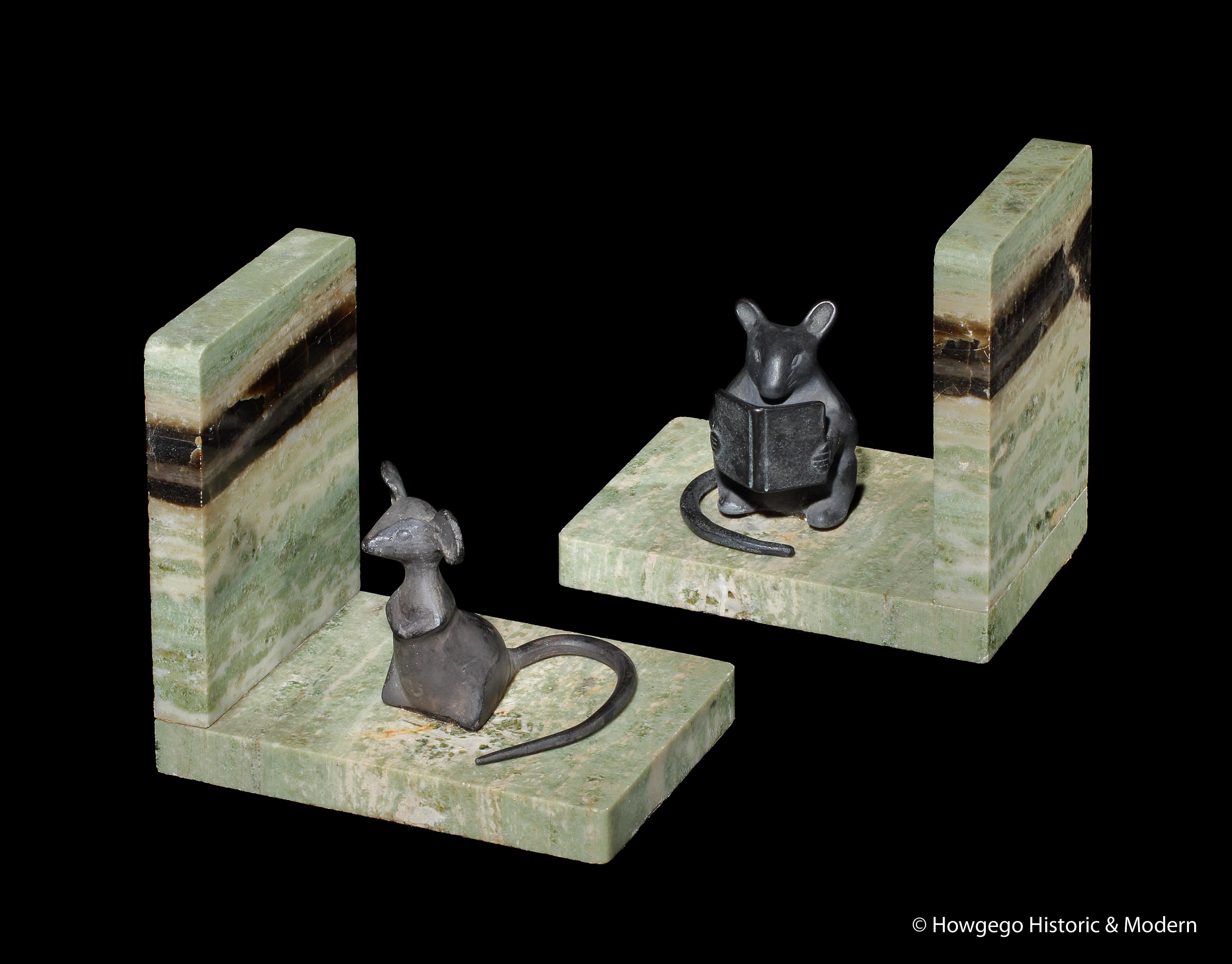 Unusual, fun, pair of art deco, marble and bronze, mouse, sculpture bookends.
One mouse is absorbed acquiring knowledge reading a book and the other is curiously looking towards the viewer or the outside world maybe he has acquired all the