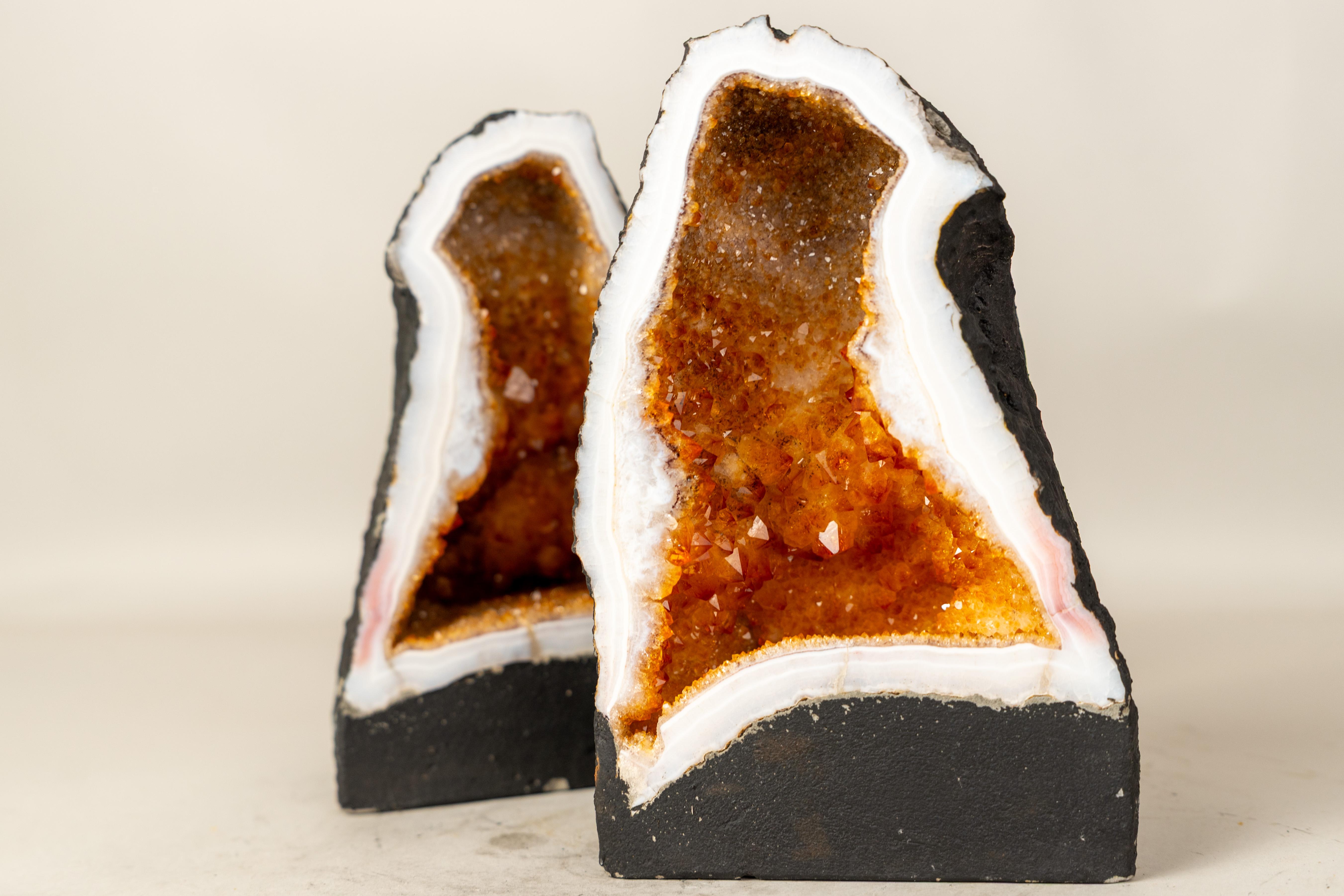 Pair of Bookmatched Citrine Geodes with Sparkling Rich Orange Druzy and Unique Natural Formation

▫️ Description ▫️ 

A bookmatched pair of geodes featuring sparkling citrine druzy in a rare sculptural formation. This pair of citrine geodes will