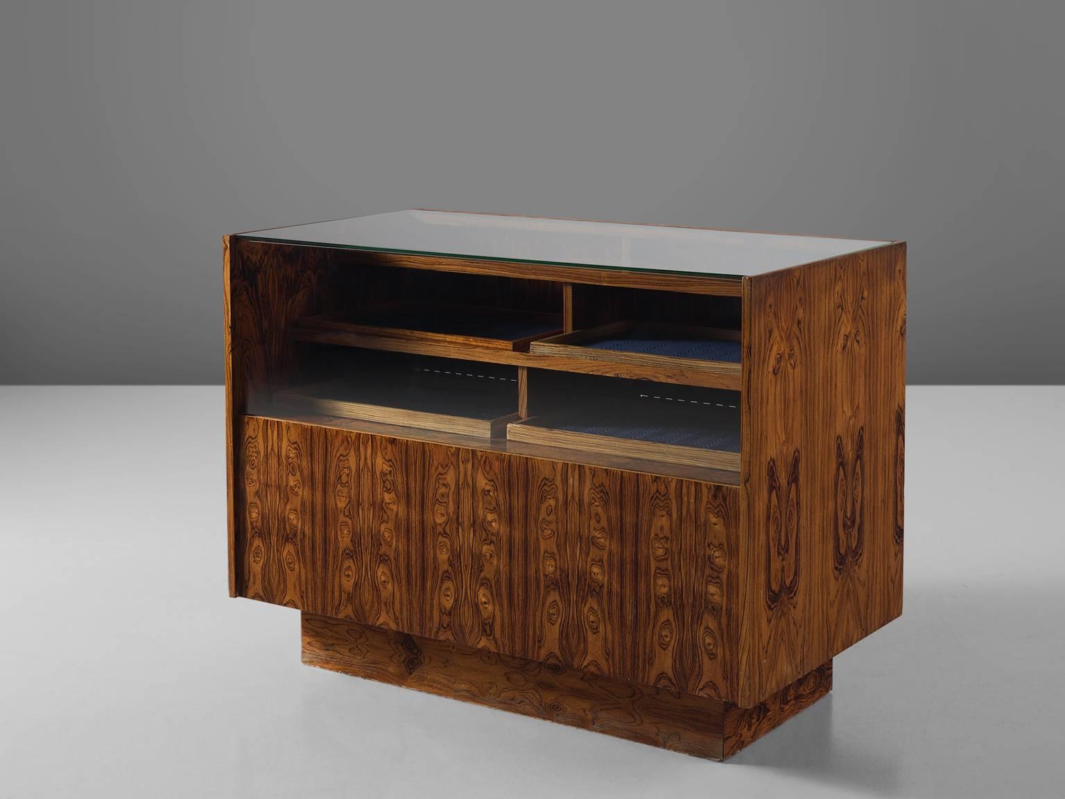 Cabinet in rosewood, Denmark, 1950s. 

Modest and refined rosewood cabinet designed. This sideboard is equipped with many storage facilities such as the storage departments on the upper part of the cabinet. This versatile item features doors,