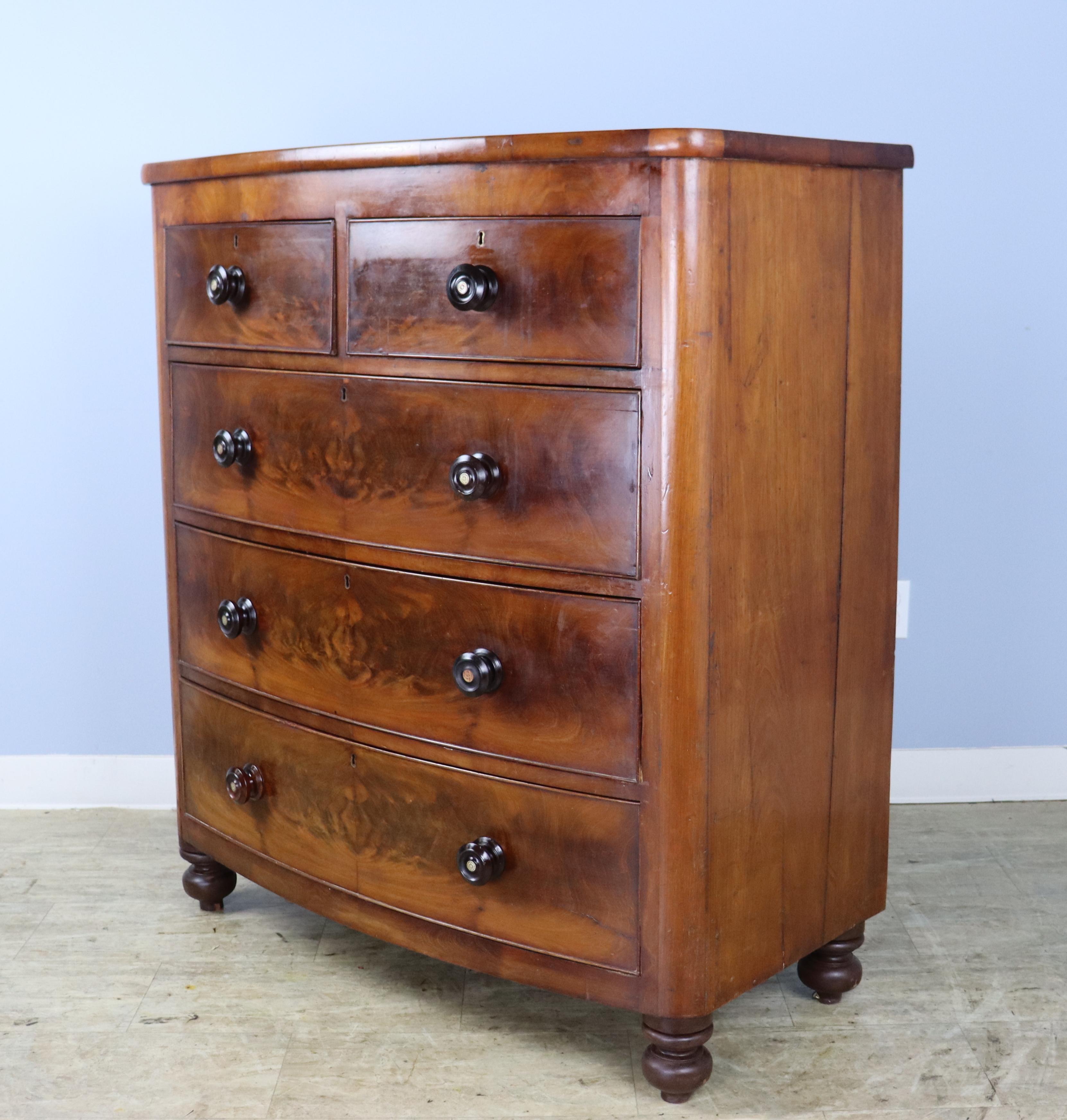 English Bookmatched Veneered Bowfront Mahogany Chest of Drawers For Sale
