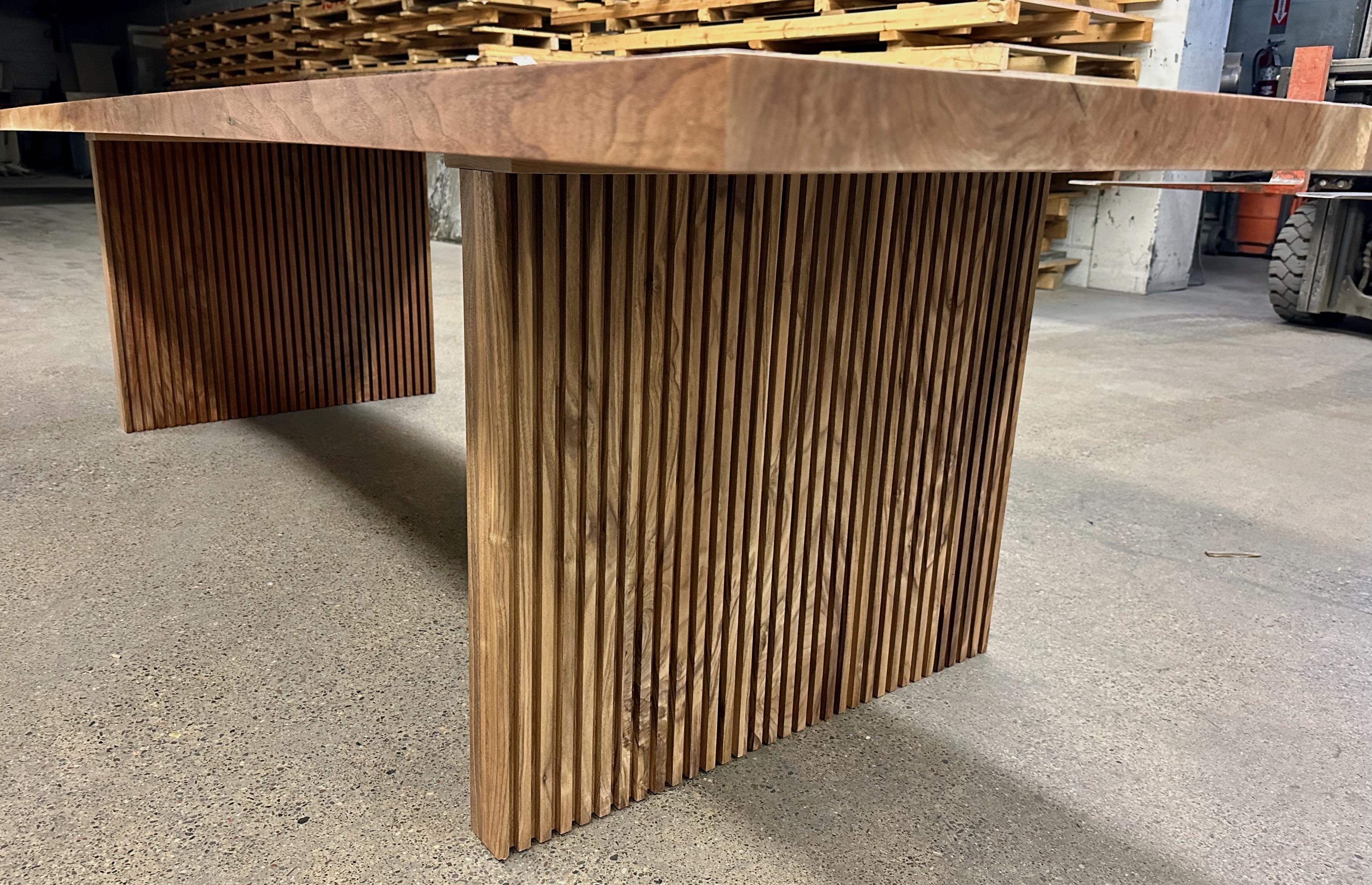 American Bookmatched walnut top dining table with fluted walnut legs For Sale