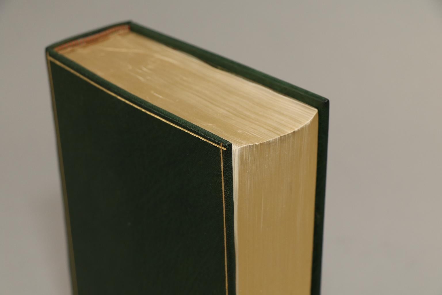 1 volume. First edition! Rebound in full green Morocco with all edges gilt, raised bands, and gilt panels. Original covers bound in the rear. Published in New York by Random House in 1957.