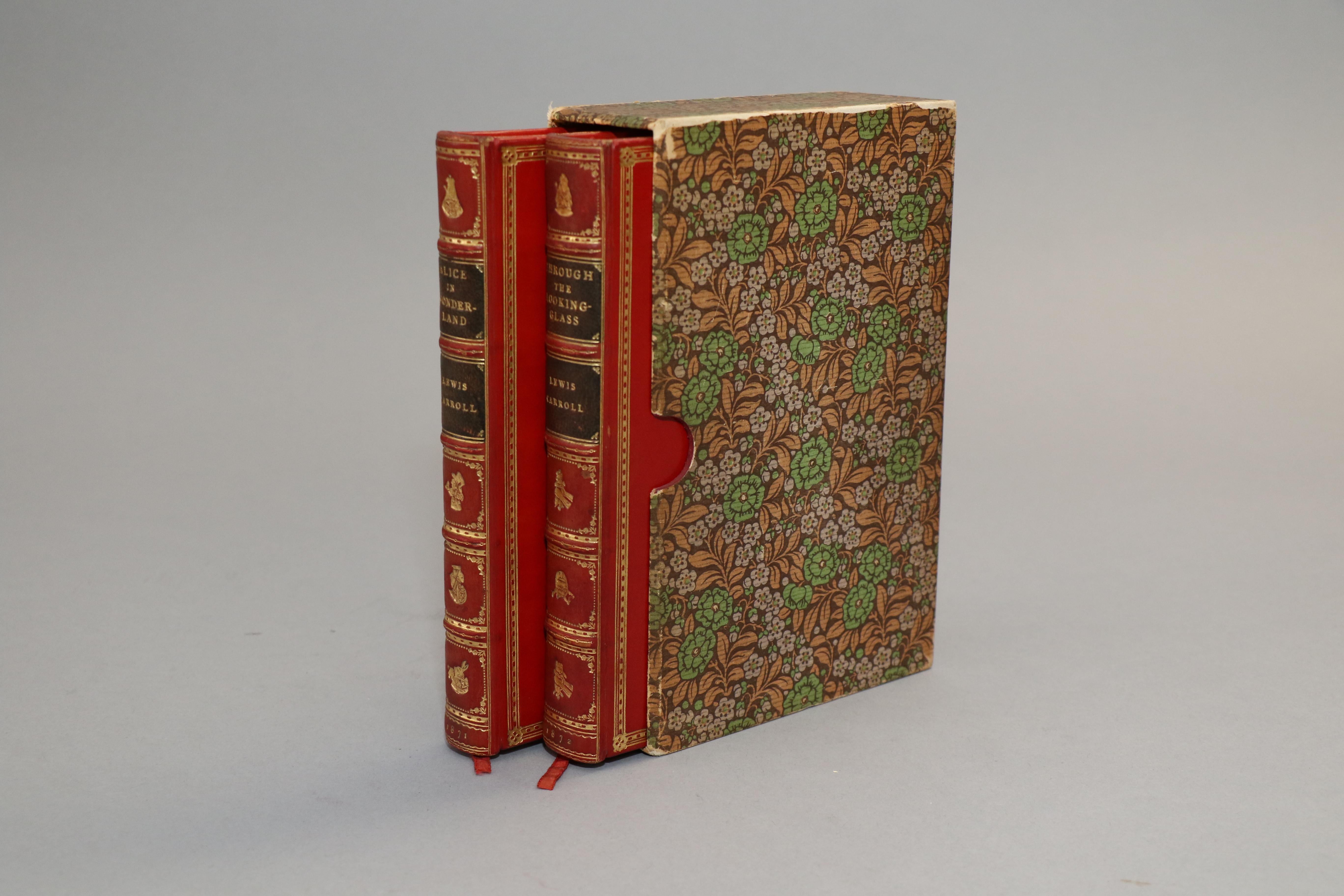 2 volumes. Early Editions! Bound in full red calf by Sangorski & Sutcliffe. Original covers bound in rear with all edges gilt, raised bands, and gilt panels. Set includes box cover. Front and rear covers feature gilt vignettes of The Queen, Alice,