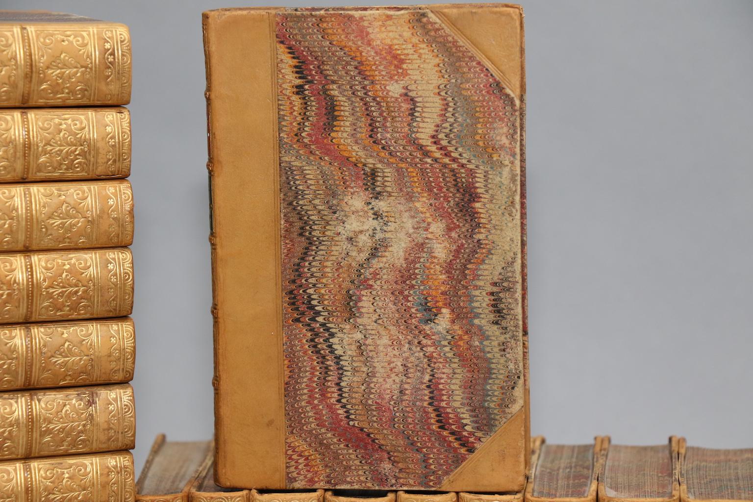 Rare first edition. Leather bound. 40 volumes. Small octavos. Contemporarily bound in three-quarter tan calf leather with marbled boards and edges and raised bands with gilt detailing on spines. Profusely illustrated with hand-colored plates